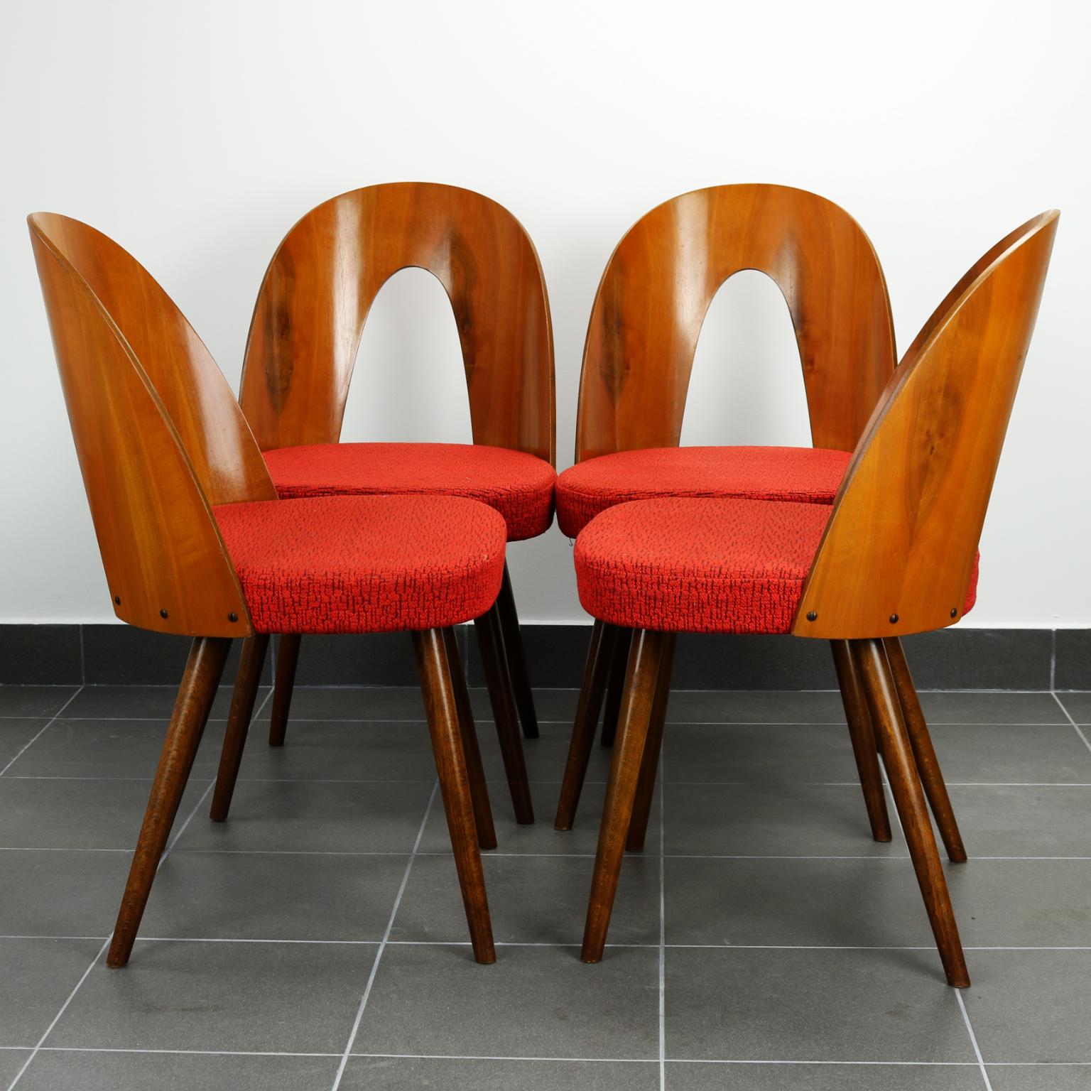 These chairs were designed by Antonin Suman, and were manufactured by the Tatra Nabytok Company, in the 1960s, in Czechoslovakia. Their red original fabric is still in perfect condition.