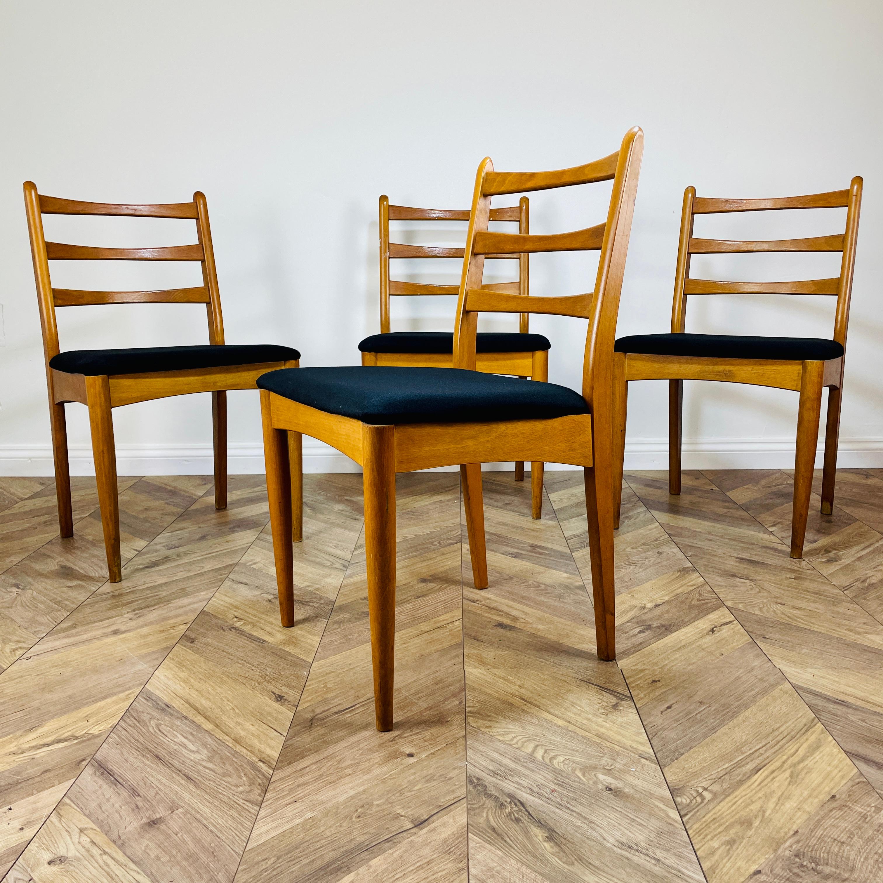 Stylish Set of 4 Vintage Dining Chairs, circa 1970s.

The chairs, which feature slatted backs and upholstered seats, were produced in Czechoslovakia by Ligna Drevounia. (makers mark to underside).

The frames are in good vintage condition with