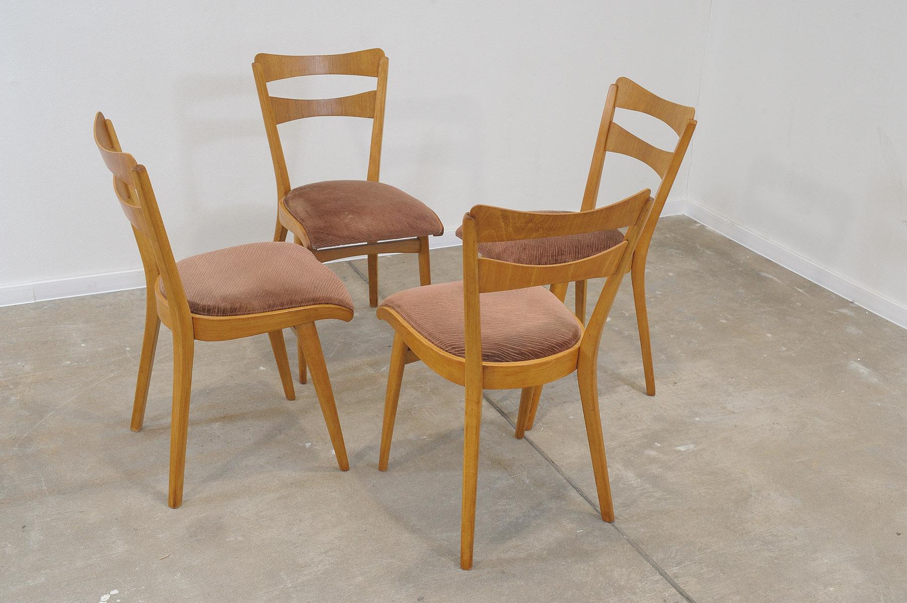 Set of four midcentury upholstered dining chairs, made in the former Czechoslovakia by Tatra nábytok company in the 1960s. The chairs are constructed of beech wood. Very interesting shaping. The upholstery and wood are in very good condition. Price