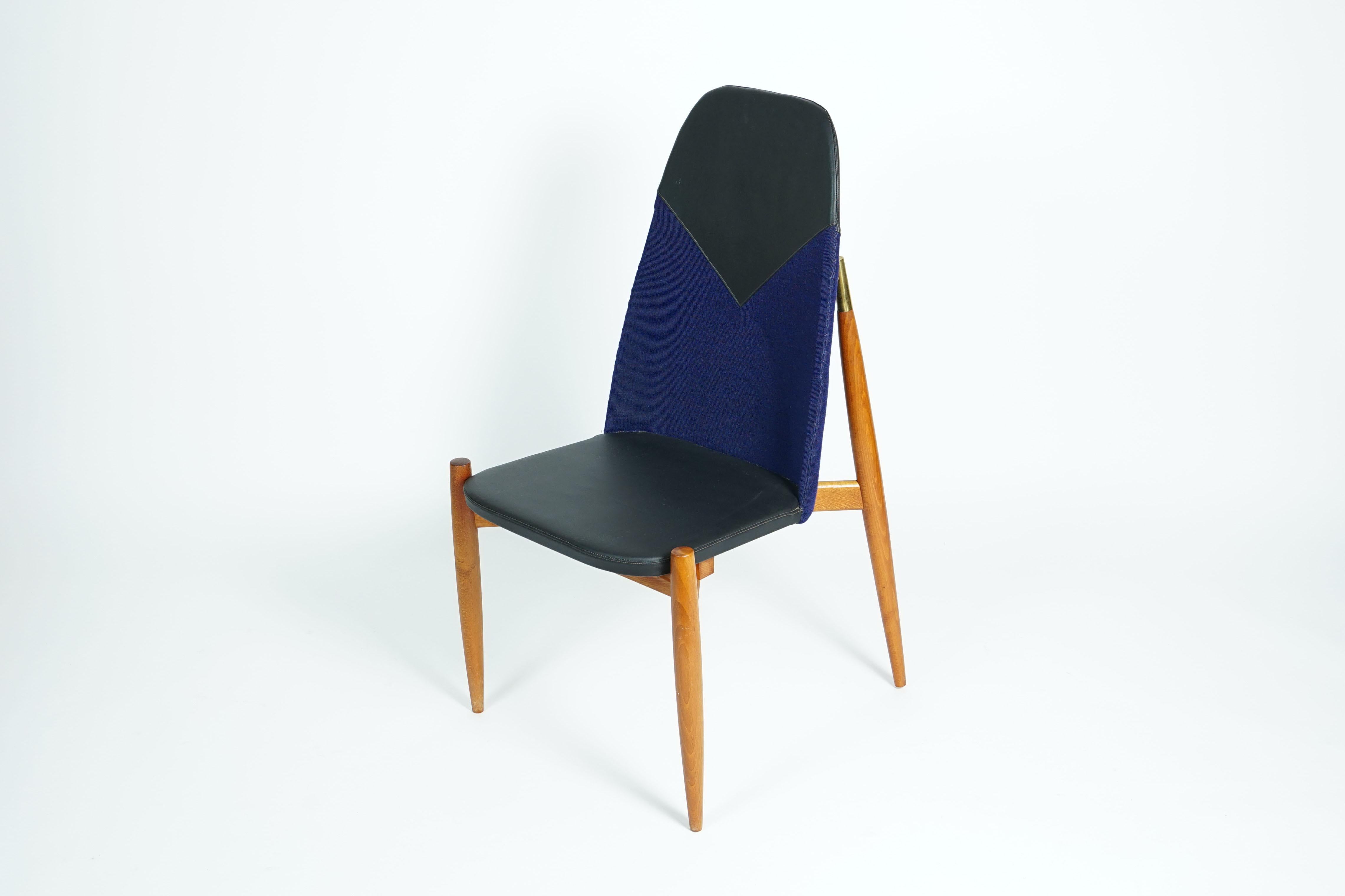 Extraordinary and rare dining room chairs, made in former Czechoslovakia by Miroslav Navratil, 1960s. 

Elegant wood and a high-quality blue fabric and artificial leather upholstery. 

Price per piece!
 