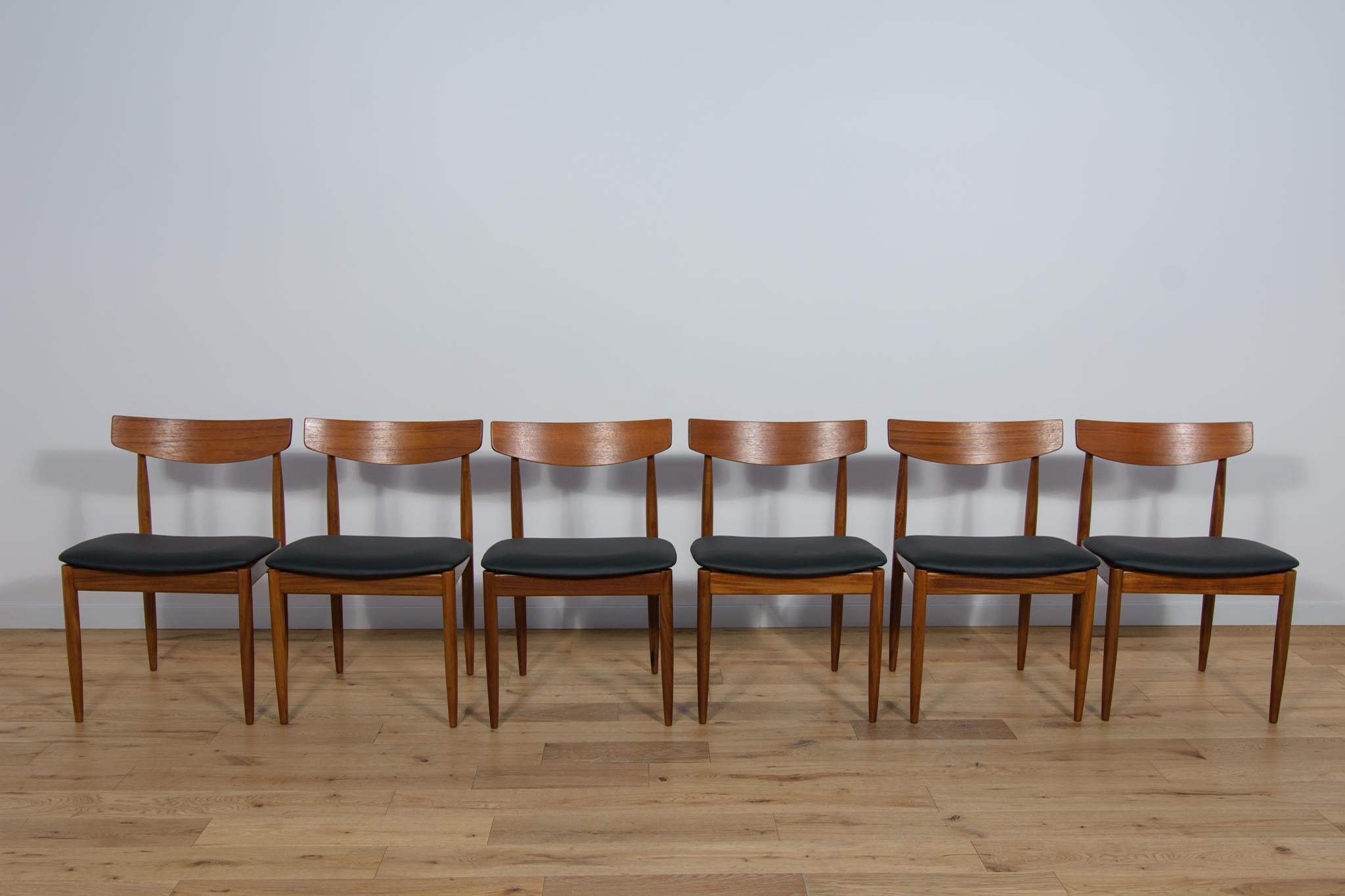 This set of six dining chairs was produced by G-Plan in the United Kingdom circa 1960. It was designed by I. Kofod- Larsen. The chairs are made of teak, have ergonomically shaped backrests. The frames are made of teak and the seats have been