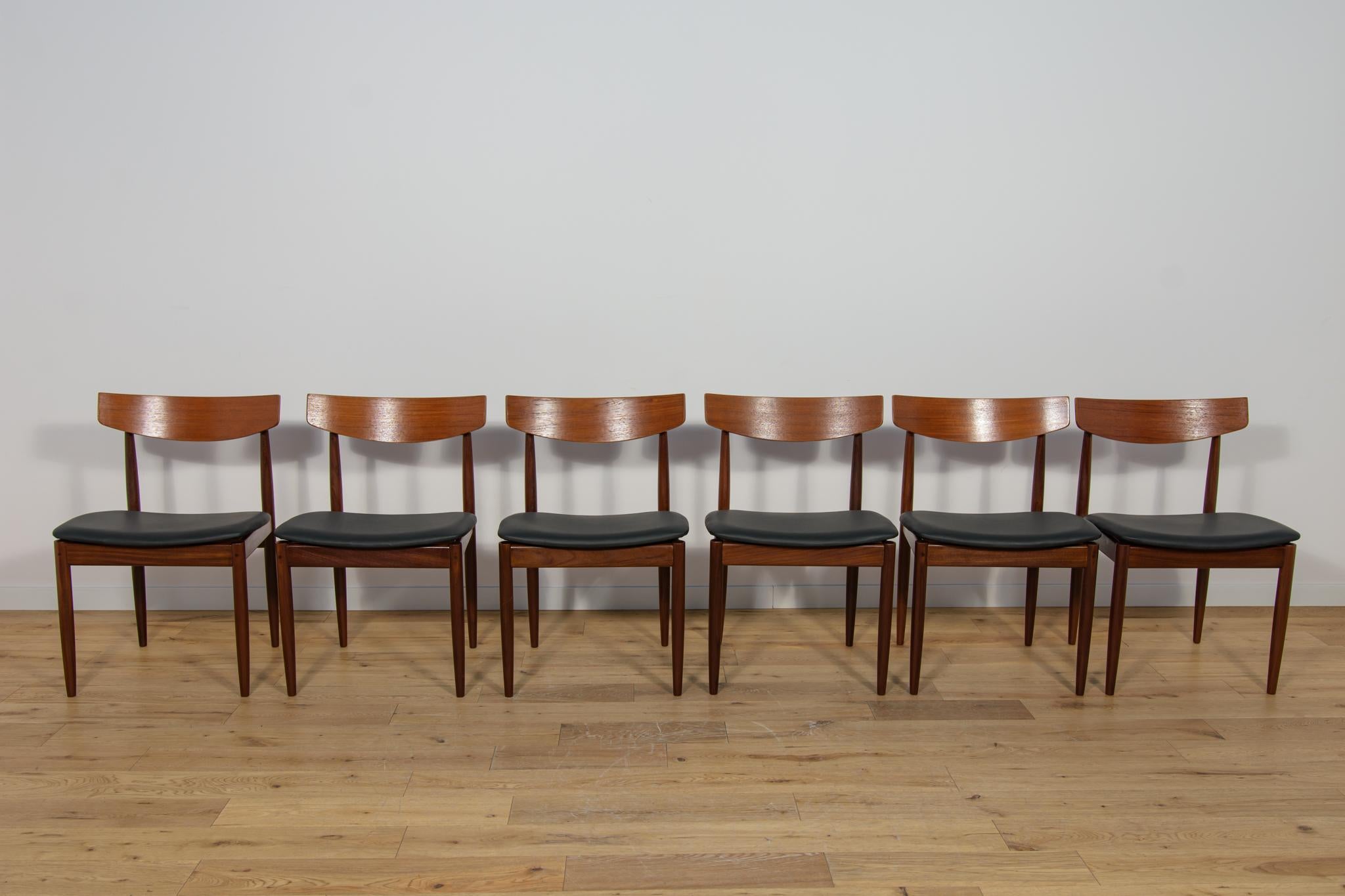This set of six dining chairs was produced by G-Plan in the United Kingdom circa 1960. It was designed by I. Kofod- Larsen. The chairs are made of teak, have ergonomically shaped backrests. The frames are made of teak and the seats have been