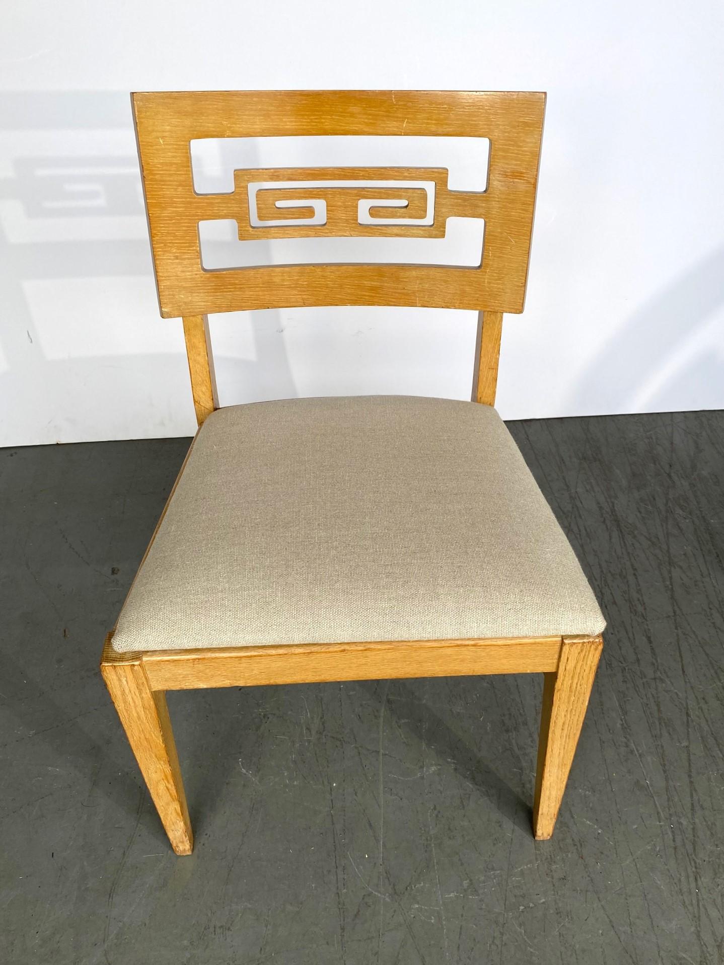 Mid-century set of eight dining chairs. The seats are covered in Belgium linen. Pair of armchairs 22.25
