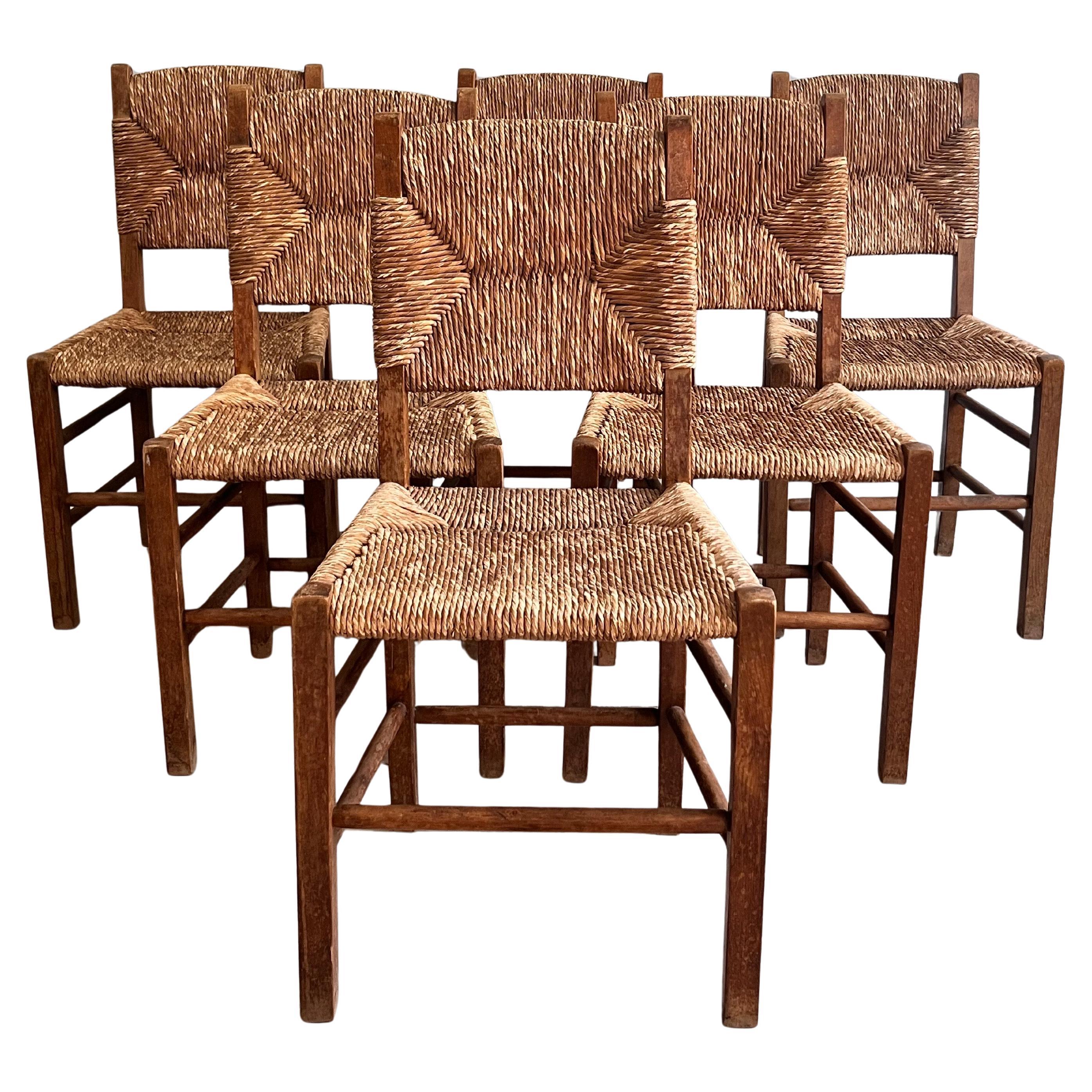 Mid century dining chairs in oak with Seat and back in seagrass