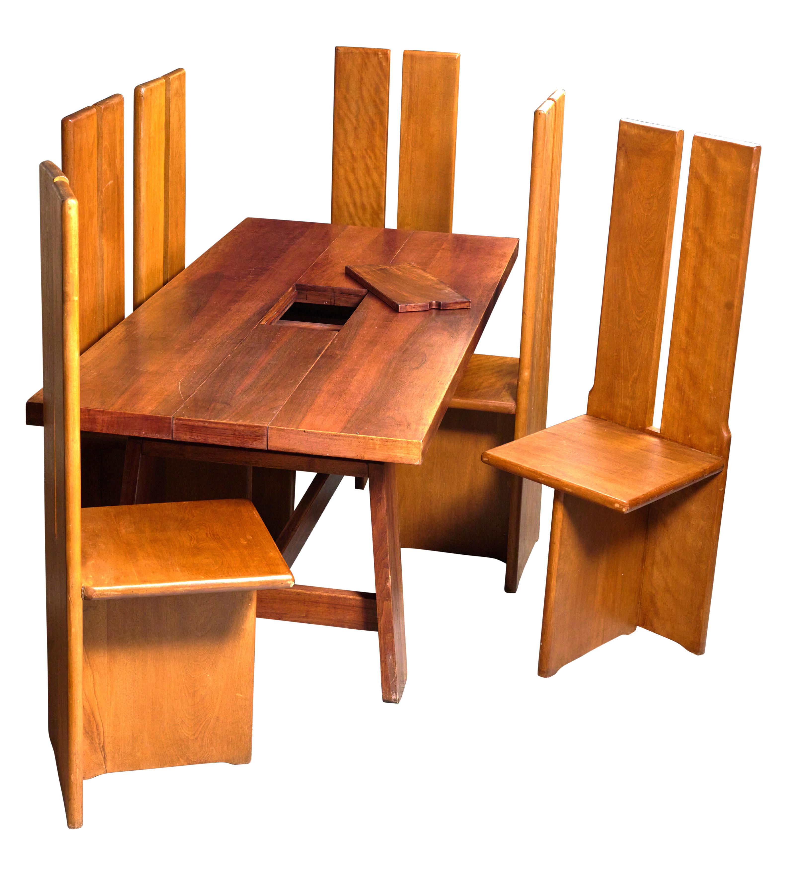 Mesa de comedor de mediados de siglo y seis sillas con almacenaje de utensilios elevable. Excelente diseño. Gran condición. 

Alto 48
