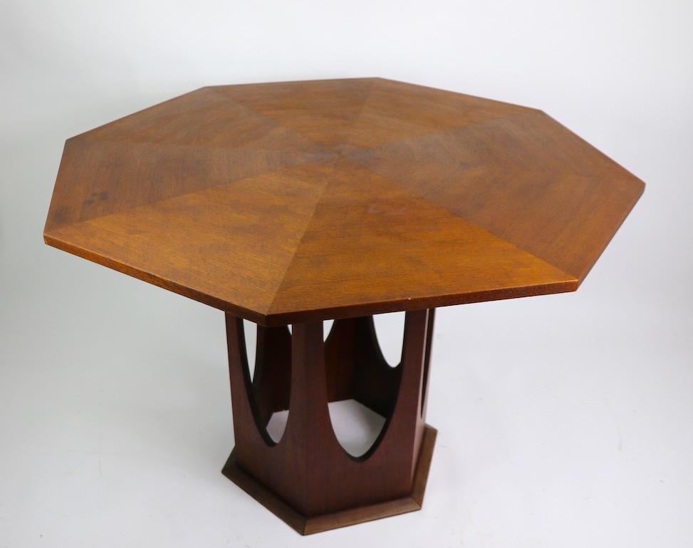 Well designed and executed architectural MCM dining table in the style of Harvey Probber. - Octagonal marquetry top supported by hexagonal open arch base. Originally designed for use as a dining table, but could also function as a center table. This