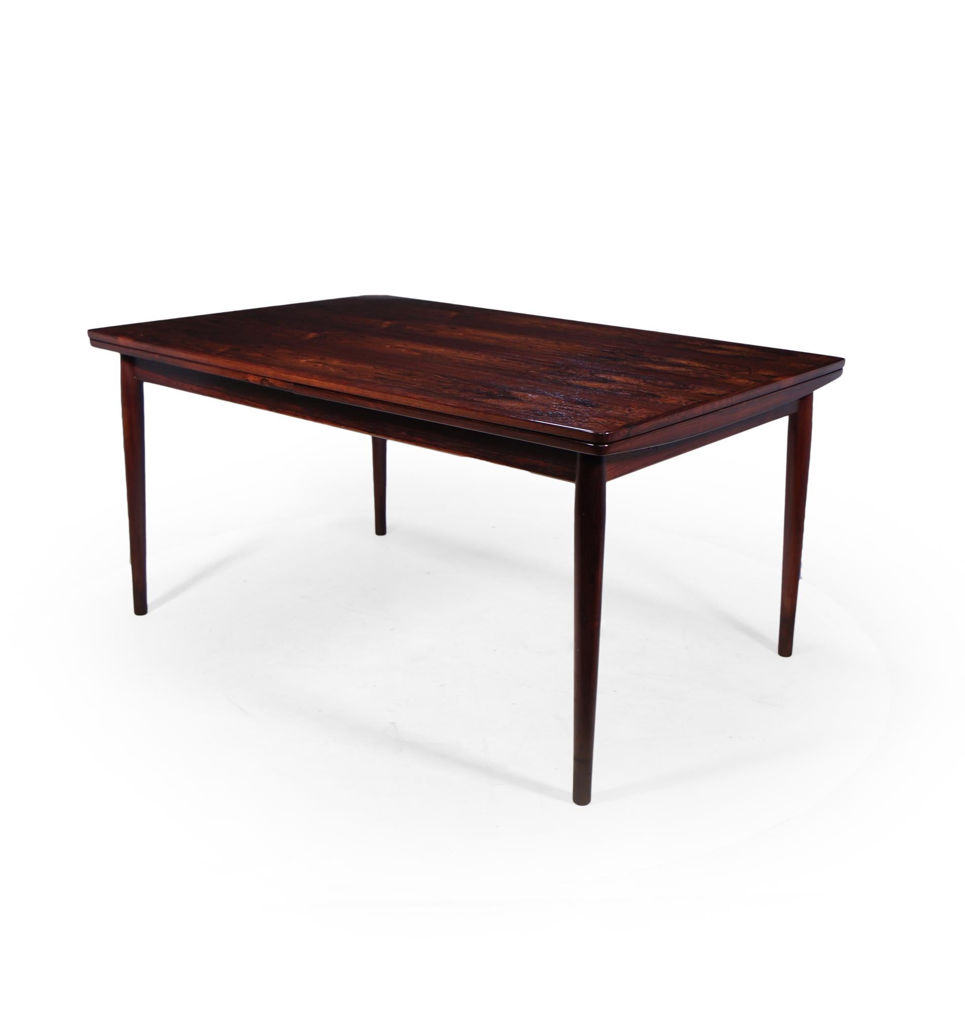 A stunning quality mid century dining table designed by Arne Vodder and produced by Sibast in Denmark in the 1950’s, this is the large version of the two sizes that were produced it starts as square seating 6 and extends to seat max 10.

the