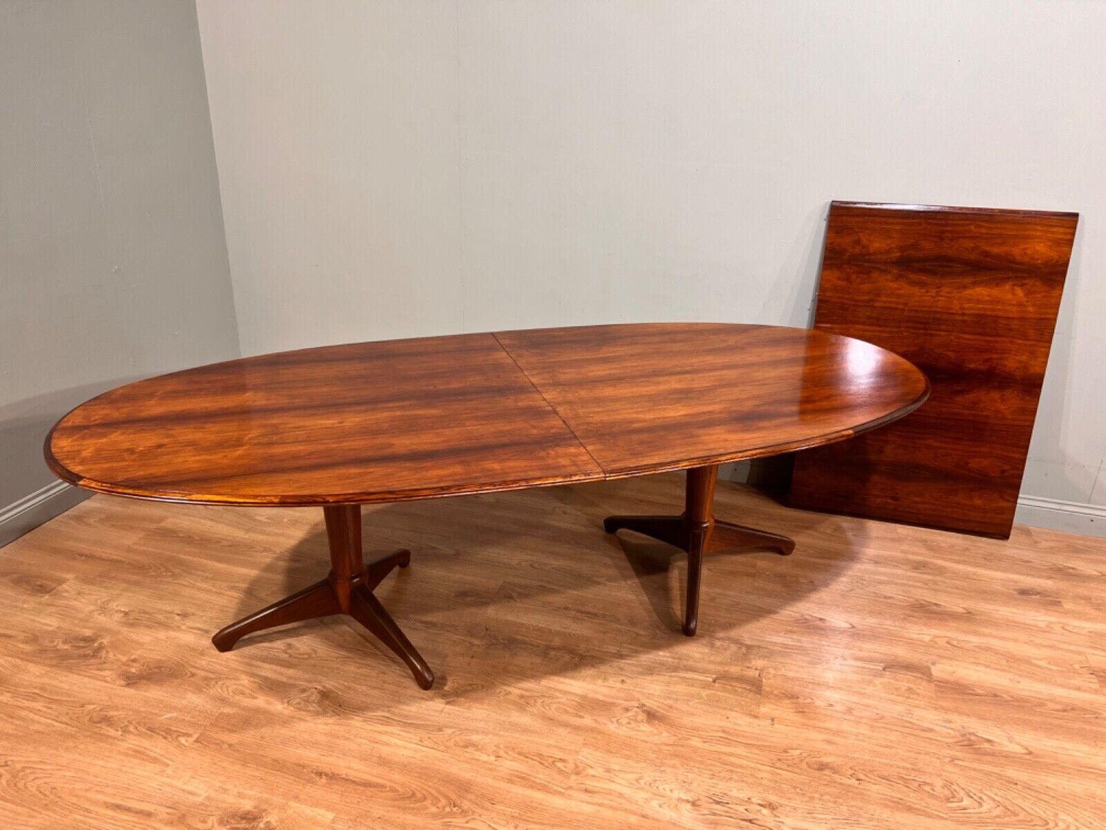 Cool Mid Century Danish style extending dining table by McIntosh
Circa 1960s on this on trend piece of vintage furntiure
Great patina to the wood which features oval ends
Table extends via a leaf system great for larger gatherings like a dinner