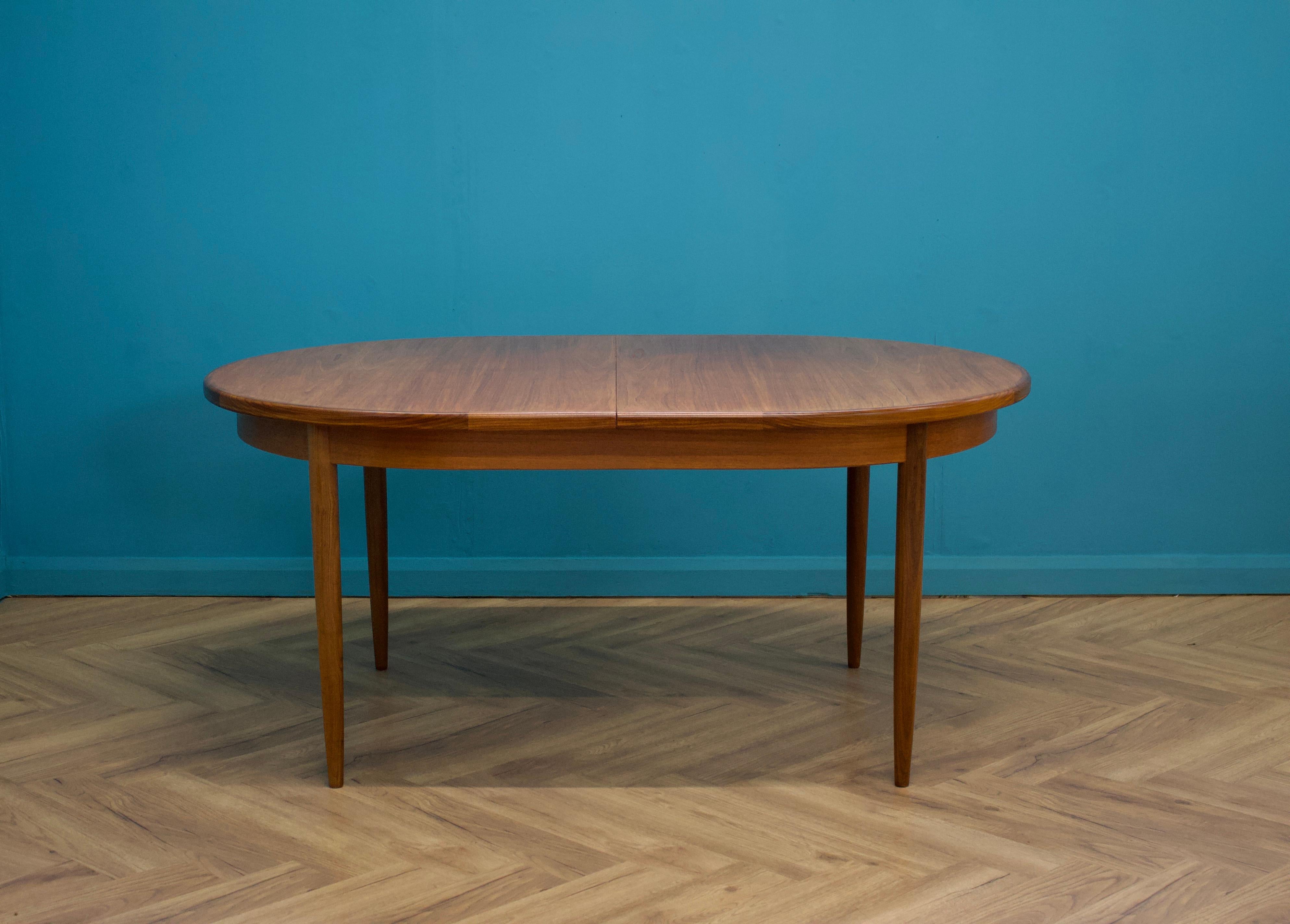 A teak extending dining table from the Fresco range, by G Plan, circa 1960s
Designed by V B Wilkins


Extended width 210cm
