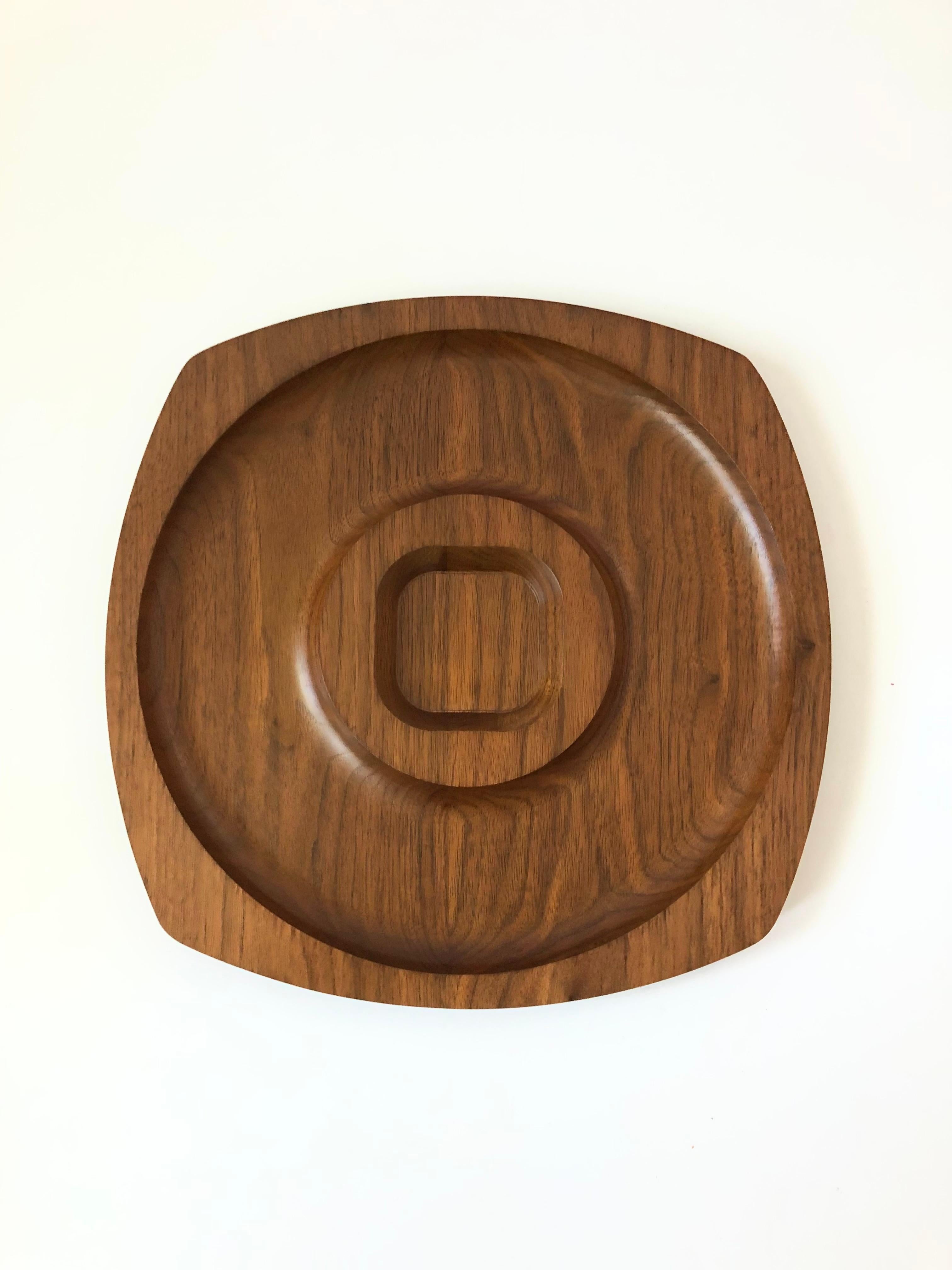 A mid century divided wood tray. Nice minimalist design in a rounded square shape. Made in Sun Valley, CA by Gladmark.