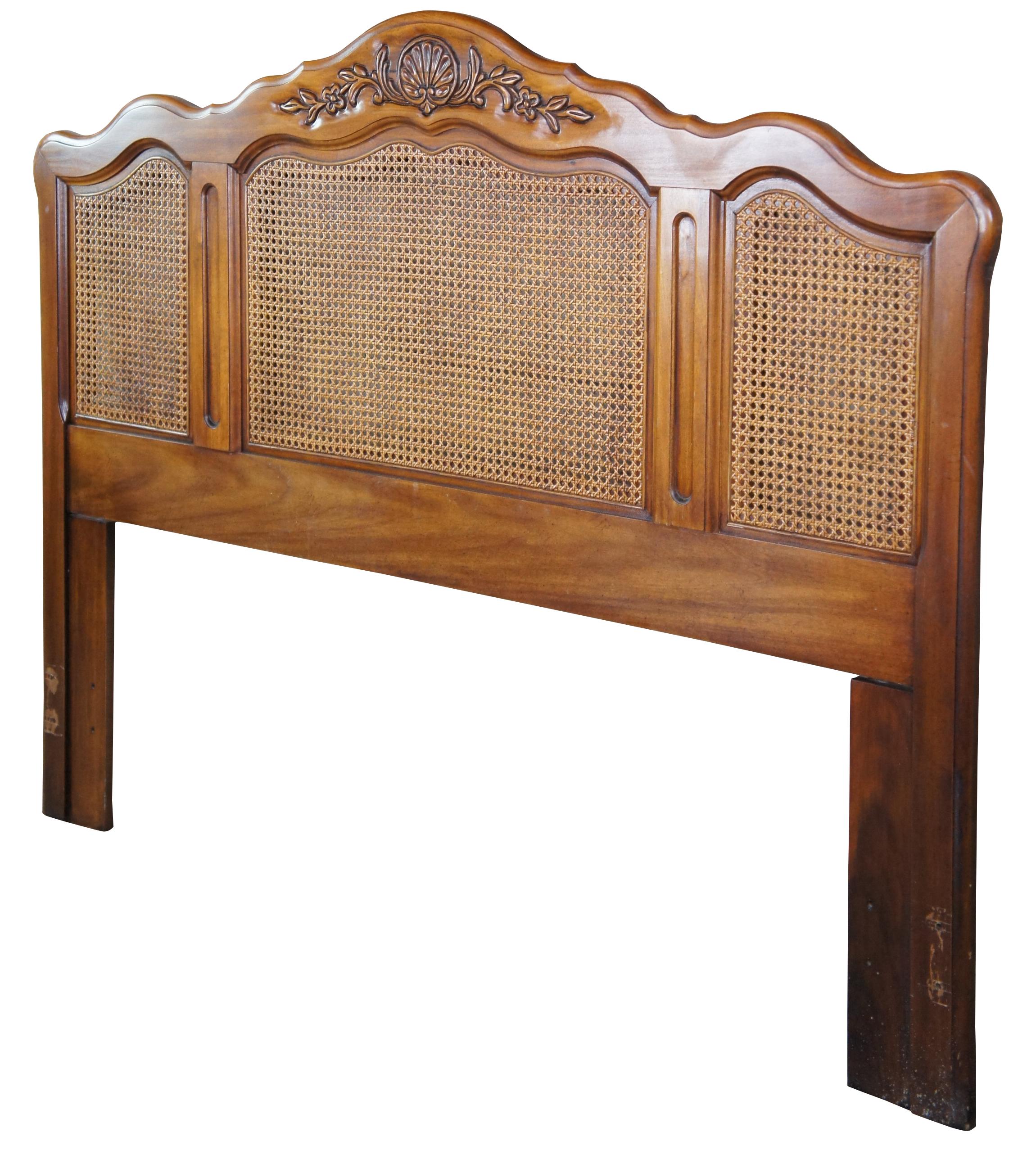 Mid century French Provincial full or queen size headboard featuring serpentine form with shell and floral design and caned back. Measure: 62