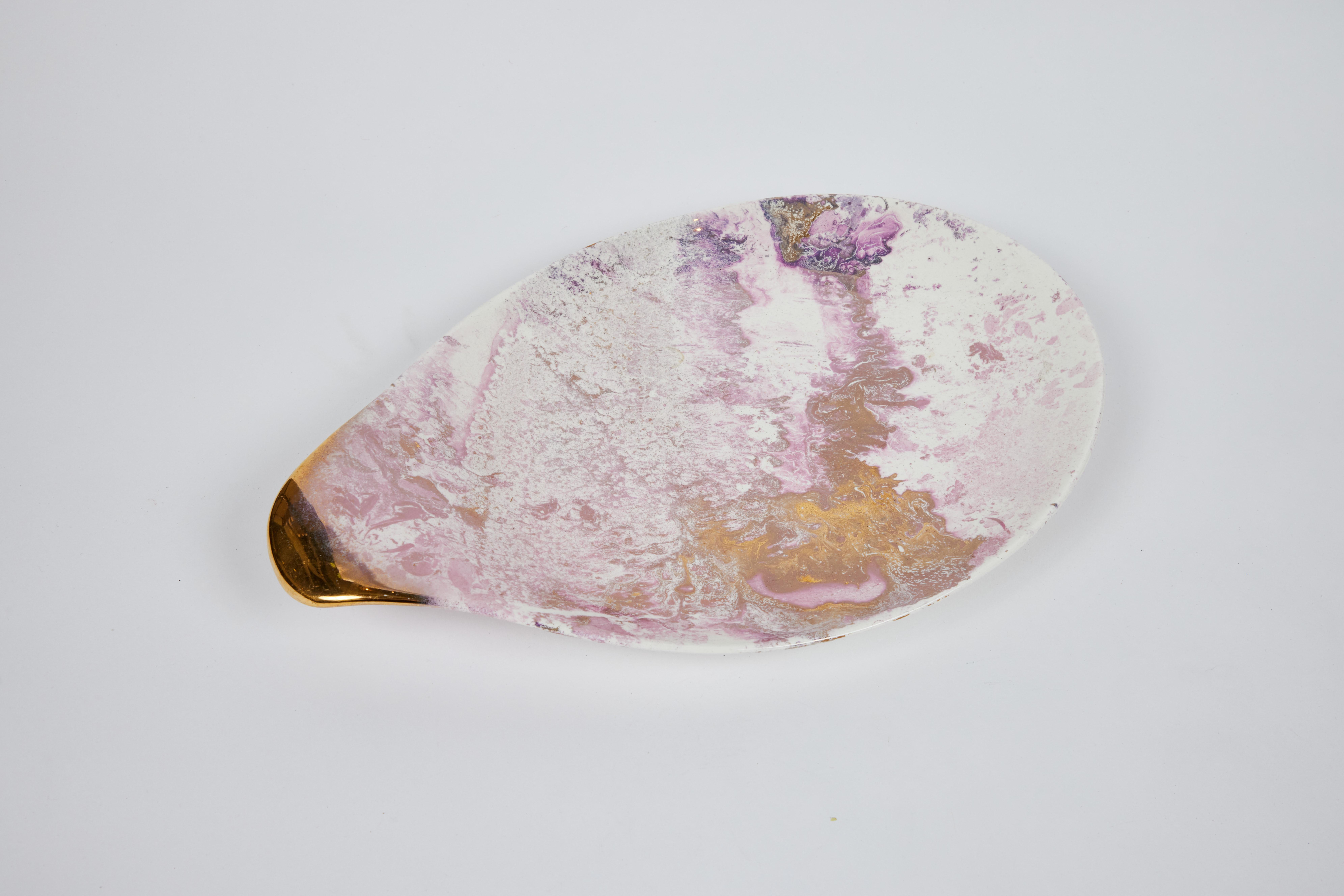 Mid century Dixie Rett (Coral Gables) ceramic dishes are decorated with a mauve pink and gold marbled glaze with a rich luster finish.

Platter: 17