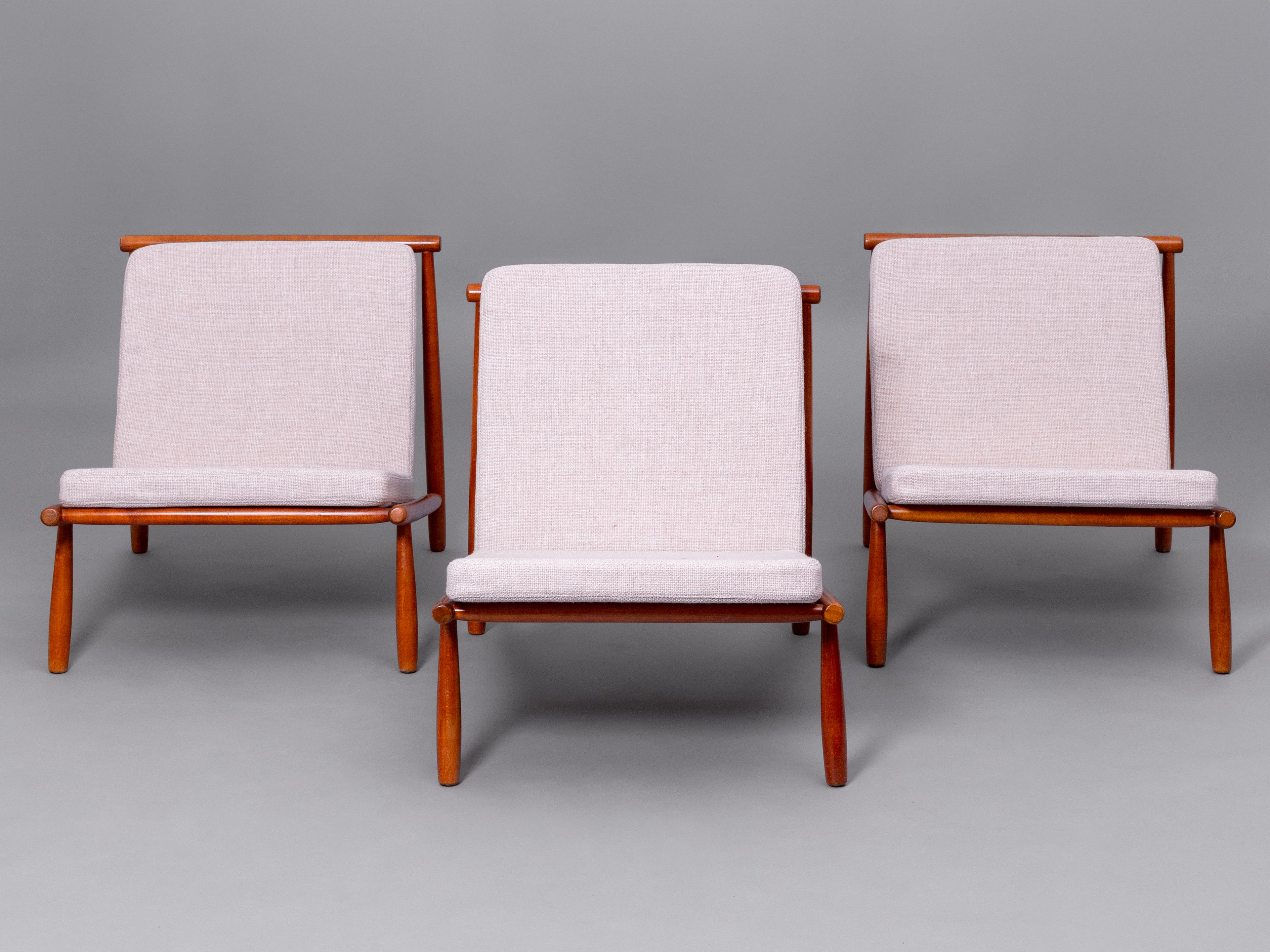 Three 'Domus' armchairs in teak and upholstery designed by Alf Svensson, Sweden, 1960s. 

These armchairs were conceived in a pure Mid-century style. The simple lines that make up the design of the structure on which the cushions rest allow us to