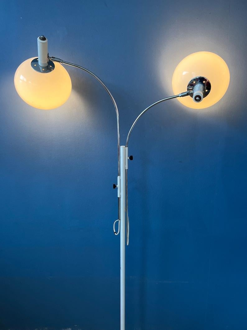 Unique space age mushroom floor lamp by Dijkstra with two chrome arms. The mushroom spots can turned in any direction desirable. Also the chrome arms can be moved up and down the stand. The lights can be switched on simultaneously or separately. The