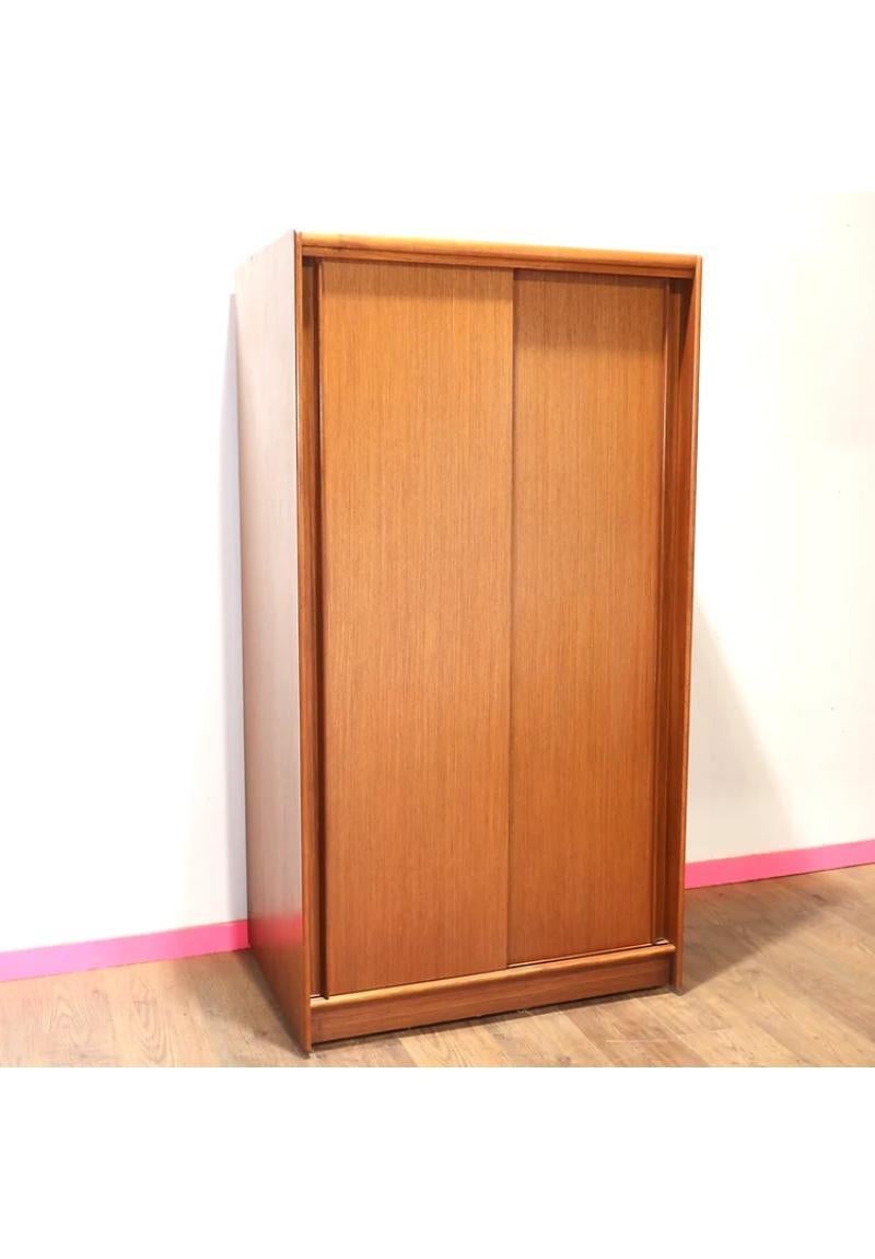 A stunning doubleMid Century armoire by Autinsuite. This is a great looking classic with plenty of storage and beautiful sliding doors is functional and stylish at the same time