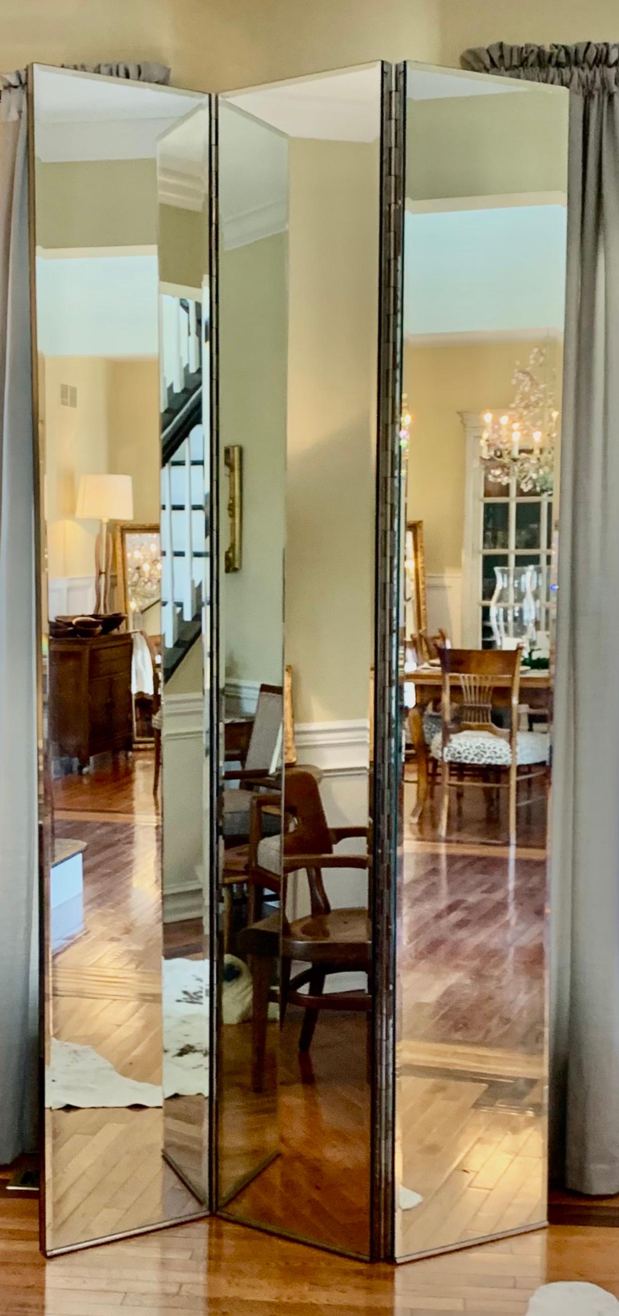 Rare and stunning vintage double-sided, three-panel mirrored room divider with full piano hinge. This piece is identical on both sides. Exquisite piano hinge runs top to bottom between the panels. The sides are also mirrored (1.25