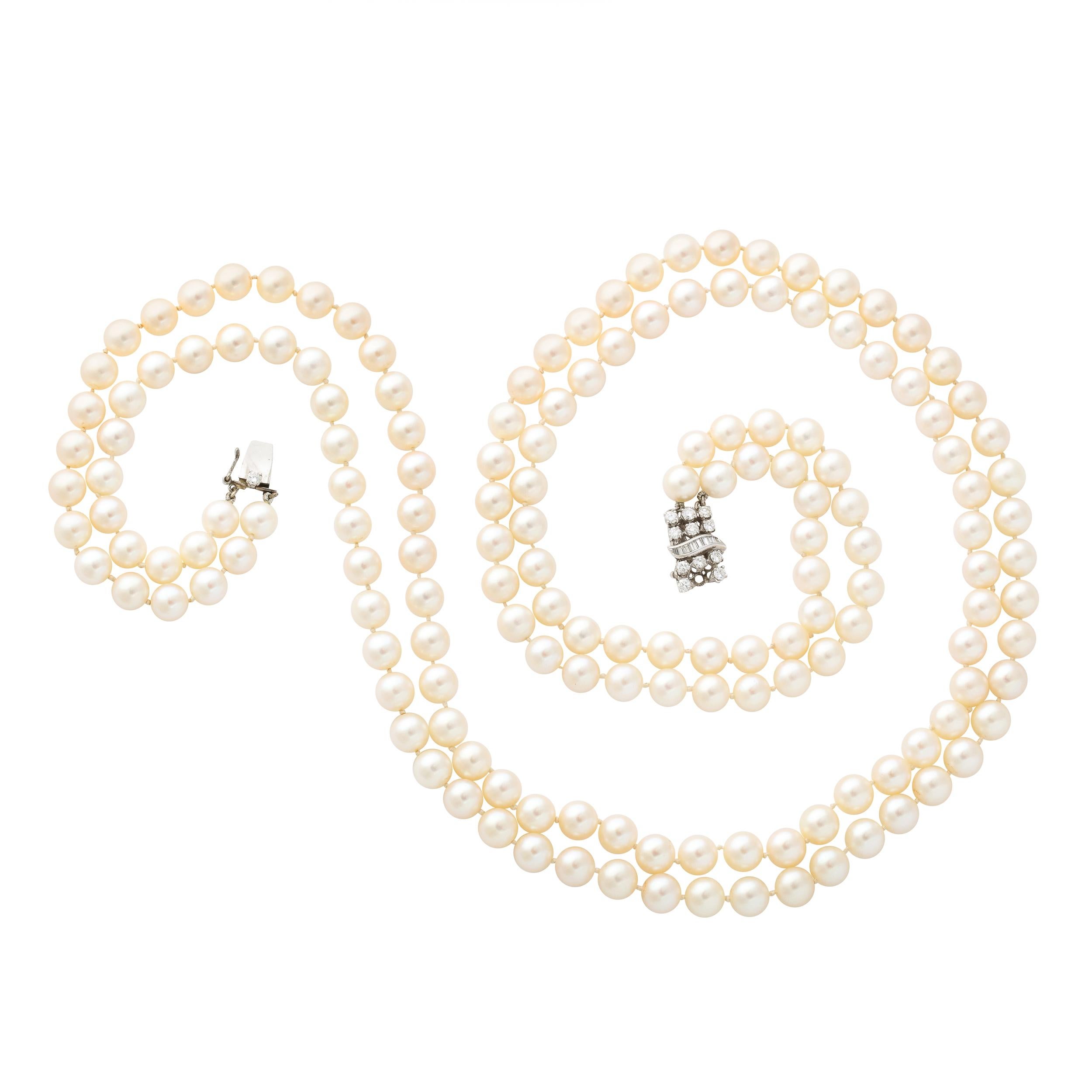 This elegant double strand pearl necklace is made of 170 7 mm cultured pearls of fine quality with a slightly rose luster and fitted with a diamond and 14k white gold clasp set with 12 round brilliant cut diamonds of approximately 1/3 carat and also