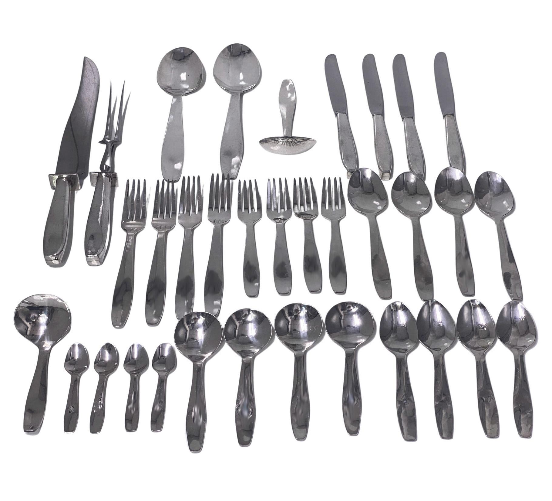 Stunning Douglas Boyd rare hand forged sterling silver flatware set for four 1966. Hand made planished with lightly hammered finish. Plain design with undulating handles. Each piece signed Signed Boyd 66. Lengths: (excluding carvers) 9.00 inches