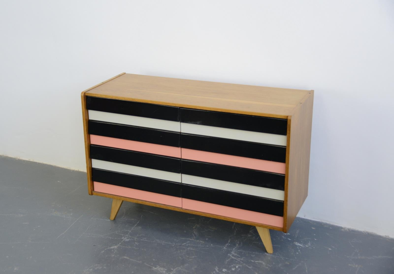 Midcentury drawers by Jiri Jiroutek for Interior Praha

- Solid oak top and sides
- 8 multicoloured drawers
- Beech atomic legs
- Design by Jiri Jiroutek 
- Made by Interior Praha
- Czech ~ 1960s
- Measures: 110cm long x 45cm deep x 76cm