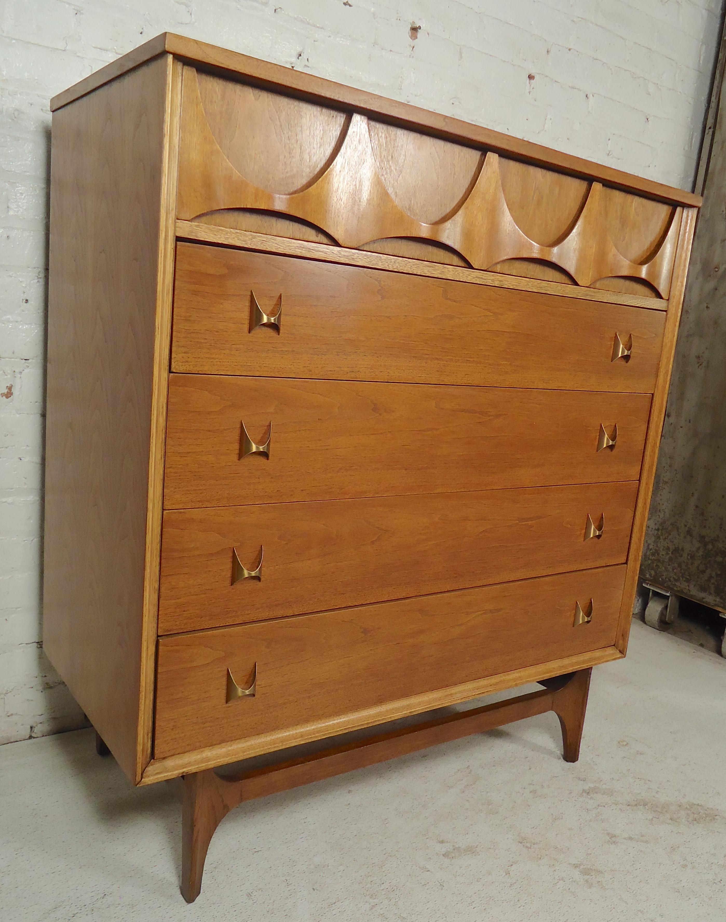 Gorgeous tall dresser by Broyhill for their Brasilia line. Sculpted wood front and brass pulls.
Matching bedroom set available.
(Please confirm item location - NY or NJ - with dealer).
 