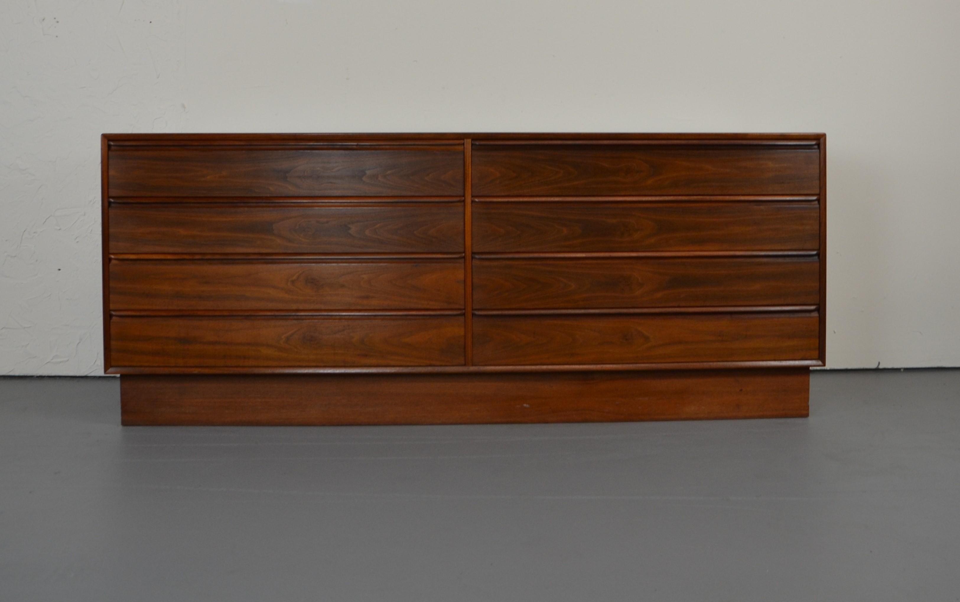 A Norwegian 1960s rosewood eight-drawer chest by Westnofa of Norway. Dresser has a well-figured top above eight side-by-side drawers rosewood veneer with solid rosewood molded handles.