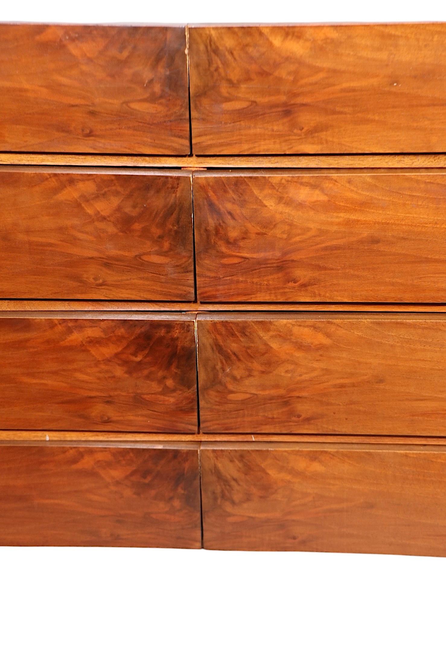 Exceptional Mid Century Exoskeleton eight drawer dresser, designed by William Hinn for Urban Furniture, made in Sweden, circa 1950's. The dresser features two banks of four drawers, which boast vibrant  book matched crotch walnut veneer, sculptural