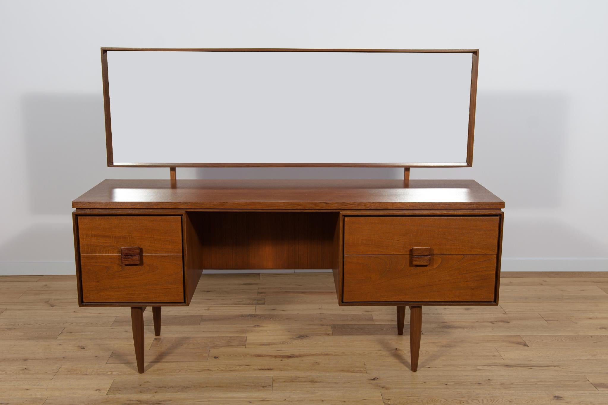 This elegant Scandinavian influenced dressing table designed by I. Kofod-Larsen for G-Plan. The dressing table has four drawers with 