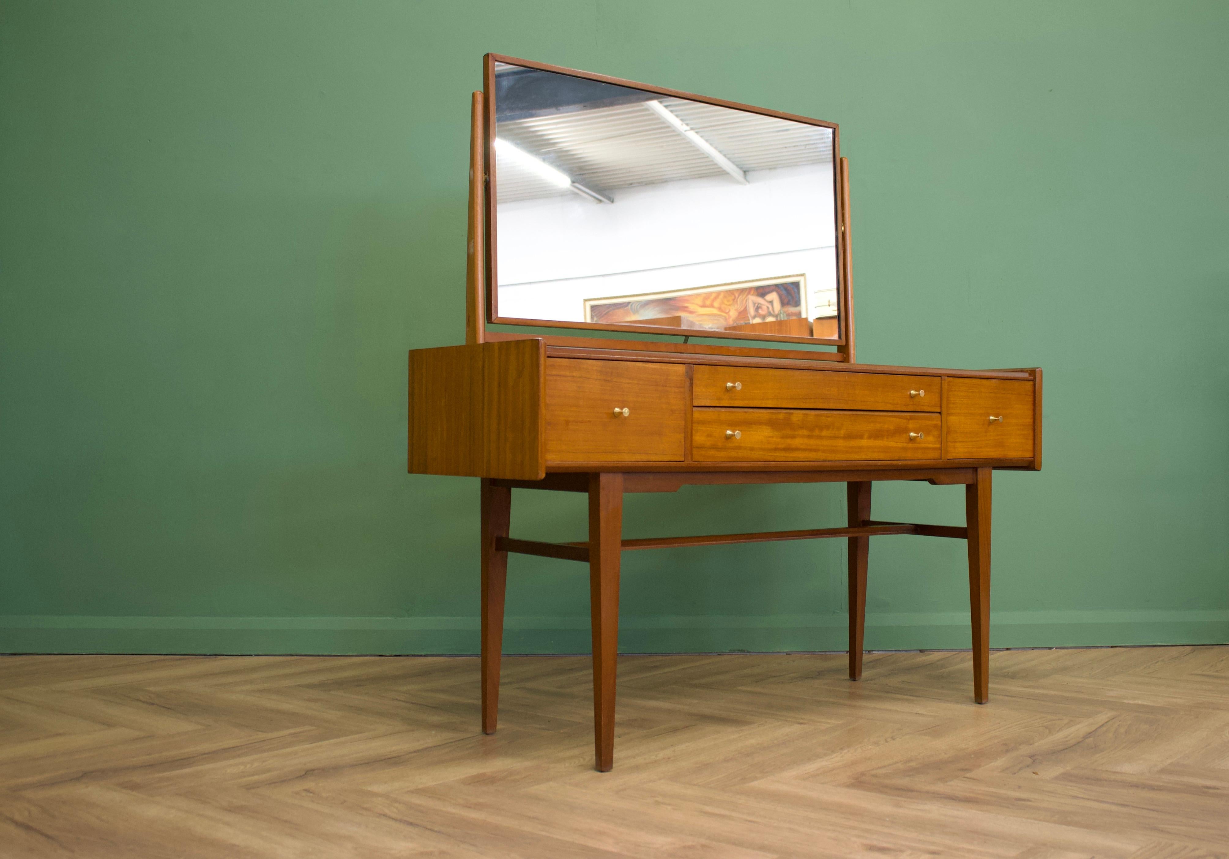 - Mid-century dressing table from Younger
- Manufactured in the UK.

- Made from walnut & walnut Veneer.

- Featuring 4 drawers 

- Height including mirror is 136.5cm.
