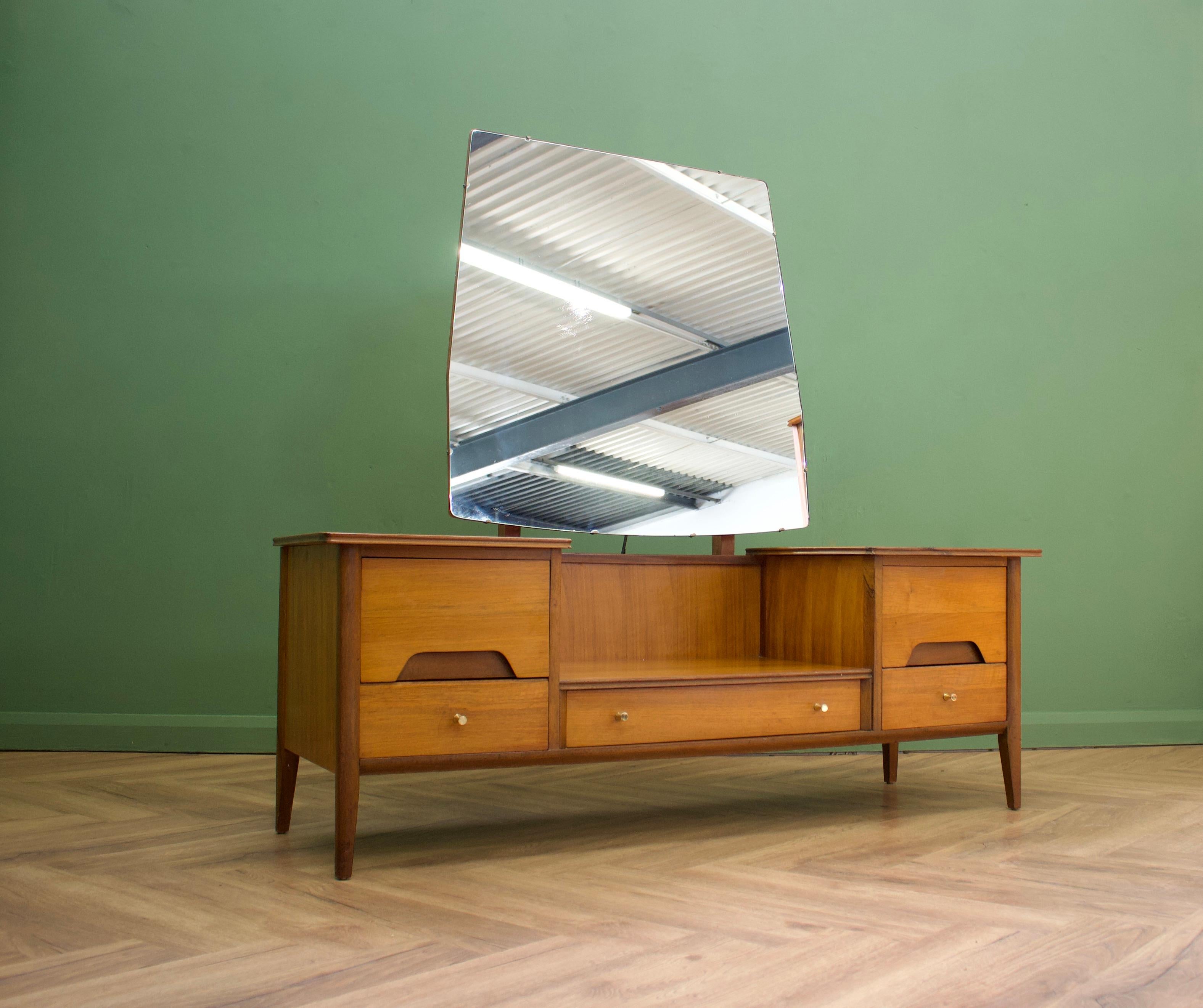 - Midcentury dressing table from Younger
- Manufactured in the UK.

- Made from walnut & walnut Veneer.

- Featuring 5 drawers 

- Height including mirror is 141cm.