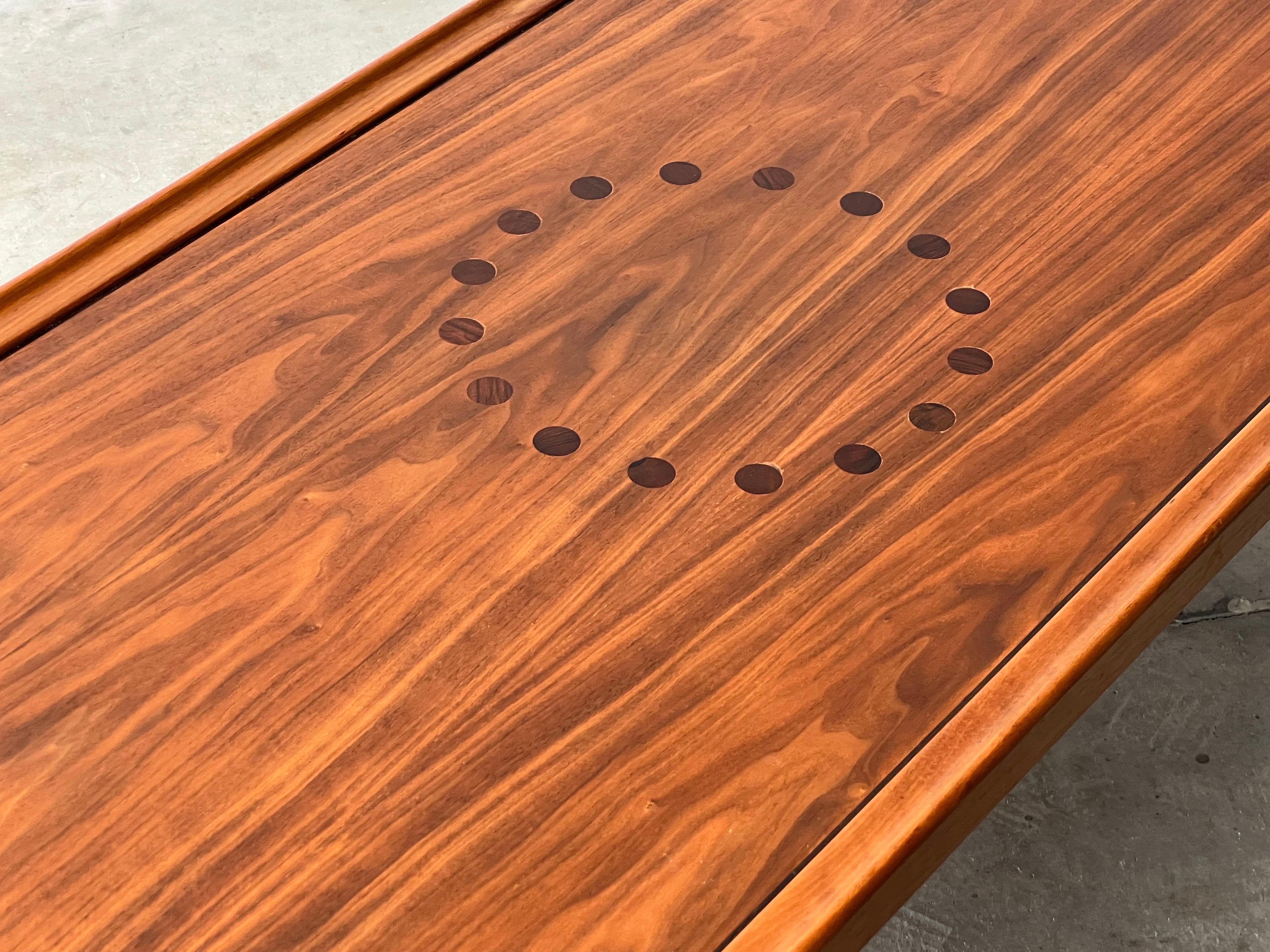 Mid-Century Drexel Declaration Walnut Coffee Table. Designed by Kipp Stewart and Stewart MacDougall for Drexel in the late 1950’s. This table shows beautiful details with rosewood inlay circle pattern and lipped edges. Very minor patina present and