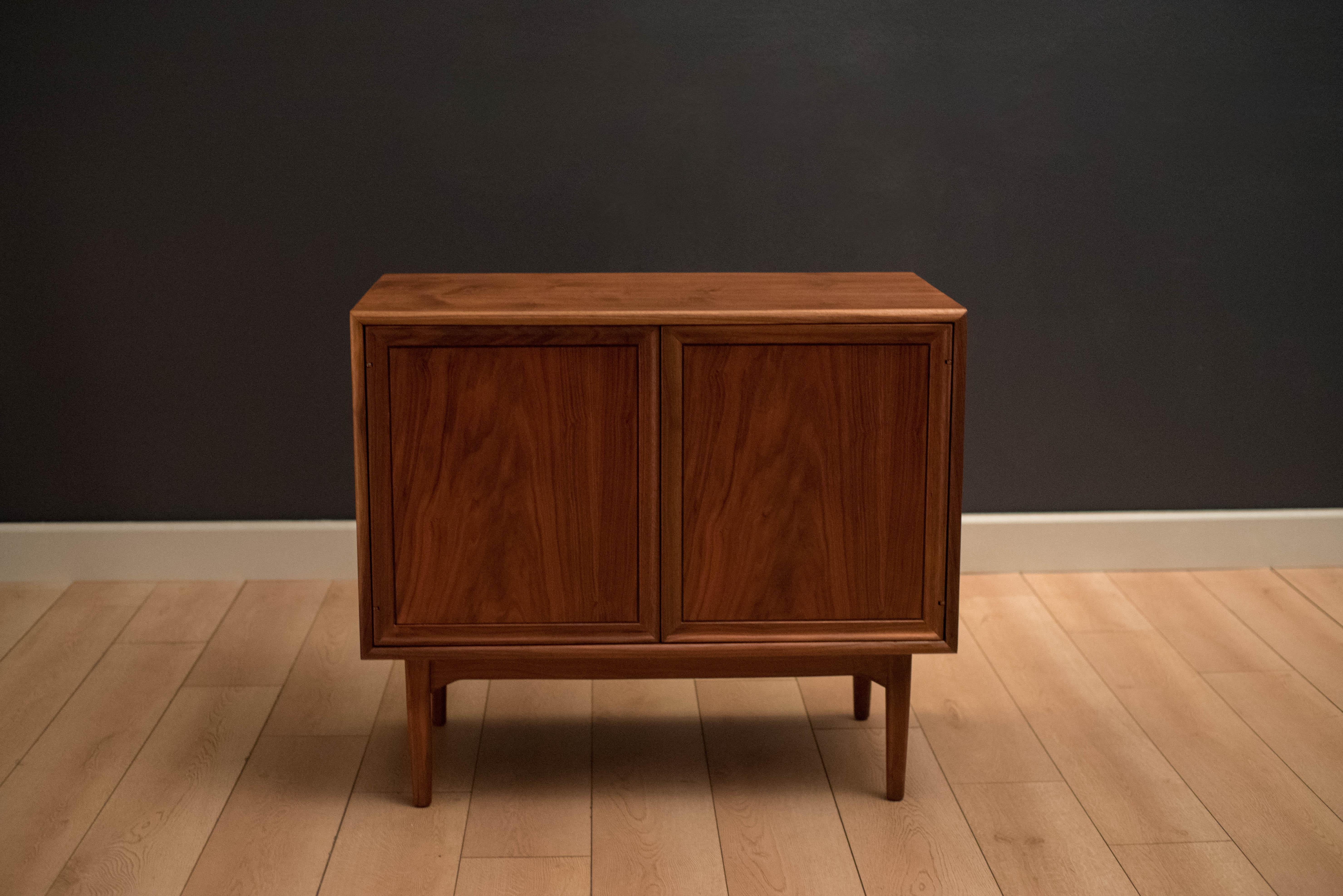 Mid-Century Modern record cabinet or credenza designed by Stewart MacDougall and Kipp Stewart for Drexel. This piece includes open storage display with one adjustable shelf.