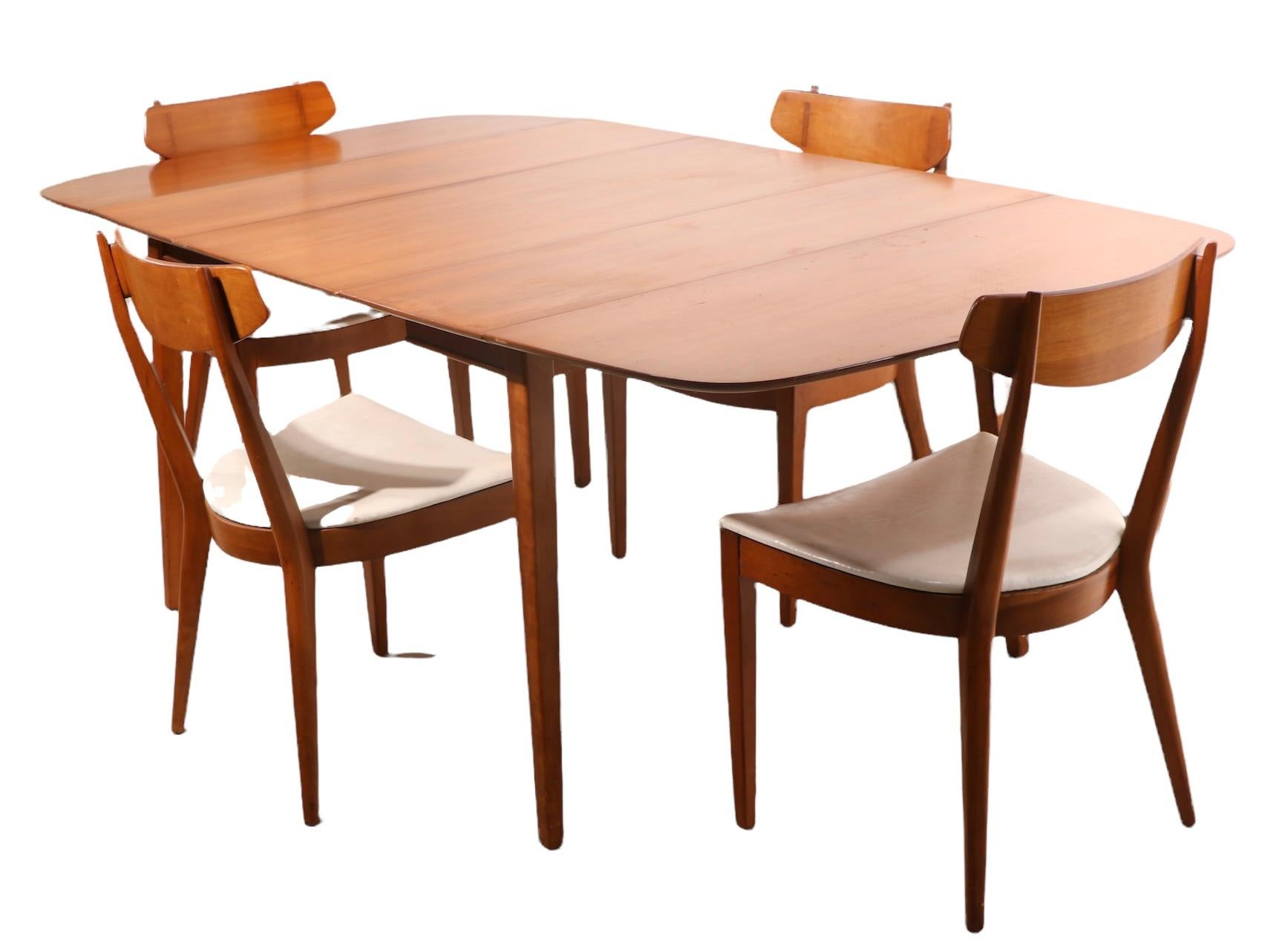 Drexel Sun Coast drop leaf dining table designed by Kipp Stewart and Stewart Mac Dougall, with one 20 in leaf. The table shows some cosmetic wear to finish, please see images. This listing is for the table only, please view the companion dining