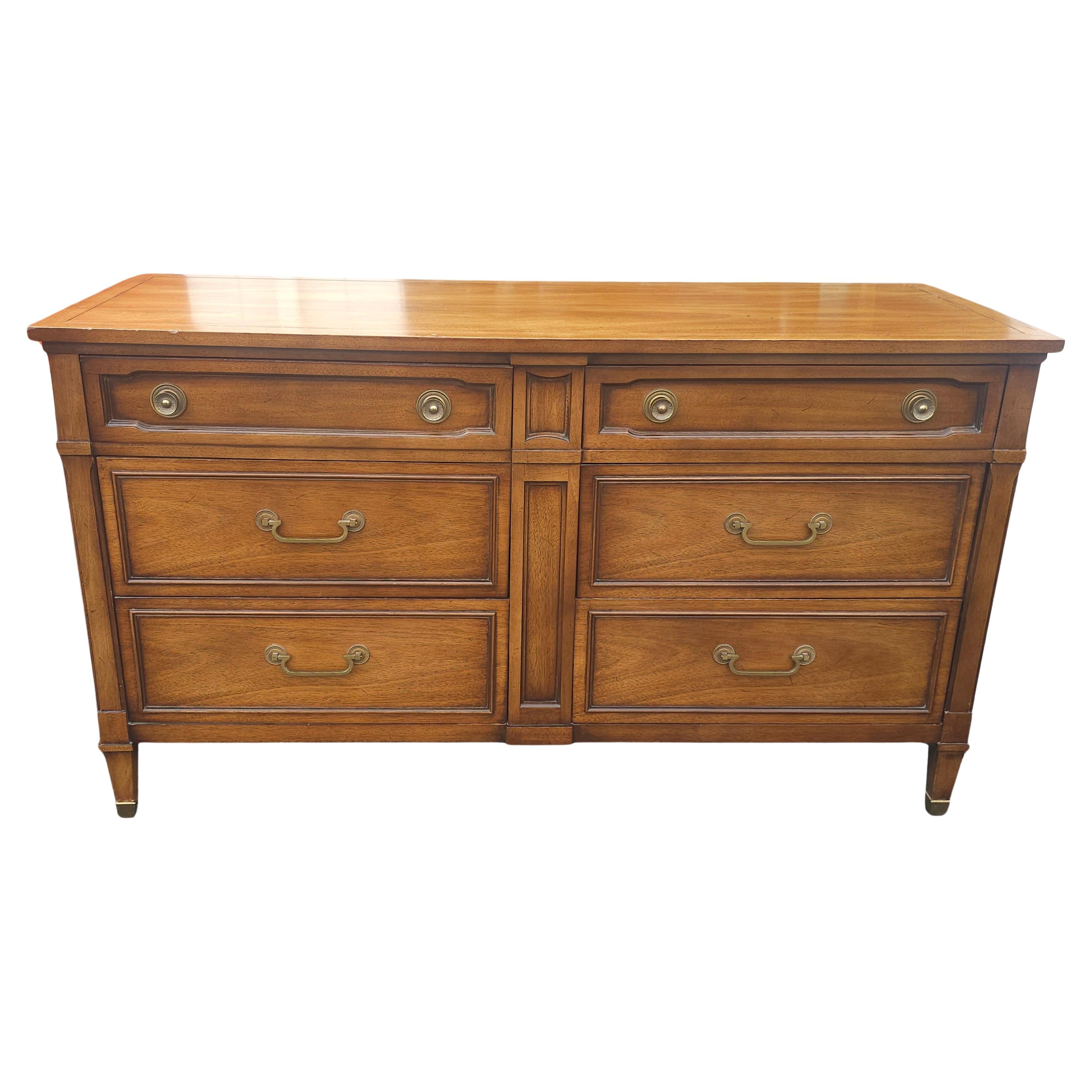 Mid-Century Drexel Truine Walnut Six Drawer Double Dresser with brass capped legs. 
Measure 56