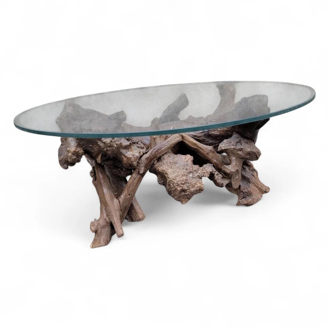 Mid Century Drift/Teak Root Live Edge Low Round Glass Top Cocktail Table 

The Table is a stunning blend of natural beauty and modern design. Featuring a unique live edge crafted from rich teak root, this table showcases the organic contours and