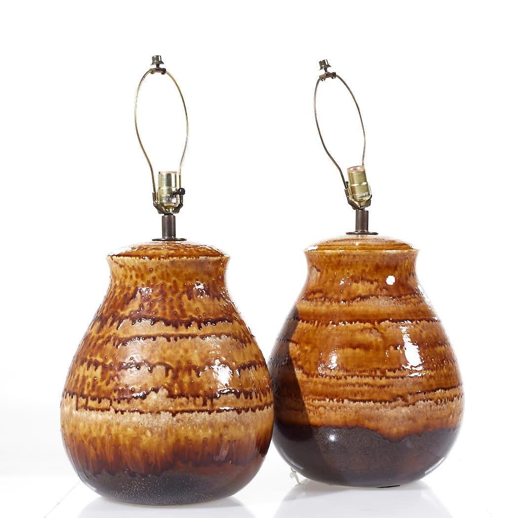 Mid Century Drip Glaze Pottery Lamps - Pair

This lamp measures: 13 wide x 13 deep x 15.5 inches high

All pieces of furniture can be had in what we call restored vintage condition. That means the piece is restored upon purchase so it’s free of