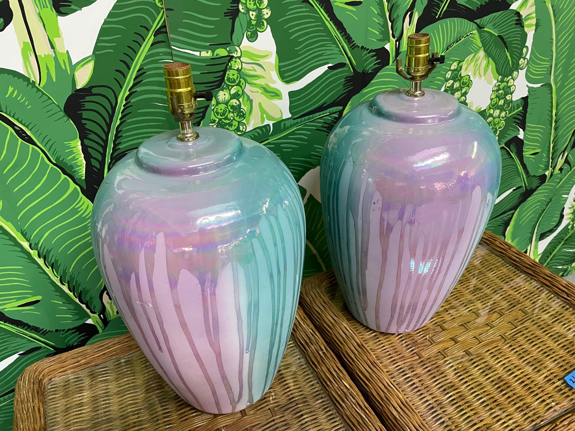 Pair of ceramic table lamps feature a drip glaze finish in teal and purple. Good condition with only very minor imperfections consistent with age.
