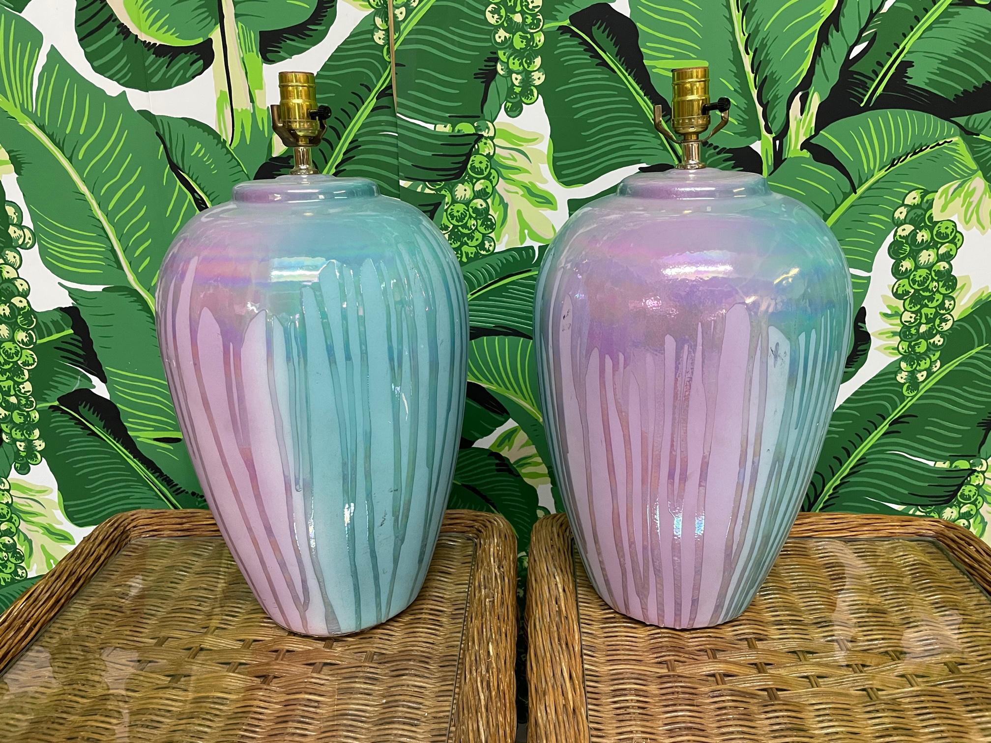 Pair of ceramic table lamps feature a drip glaze finish in teal and purple. Good condition with minor imperfections consistent with age, see photos for condition details. 
For a shipping quote to your exact zip code, please message us.
