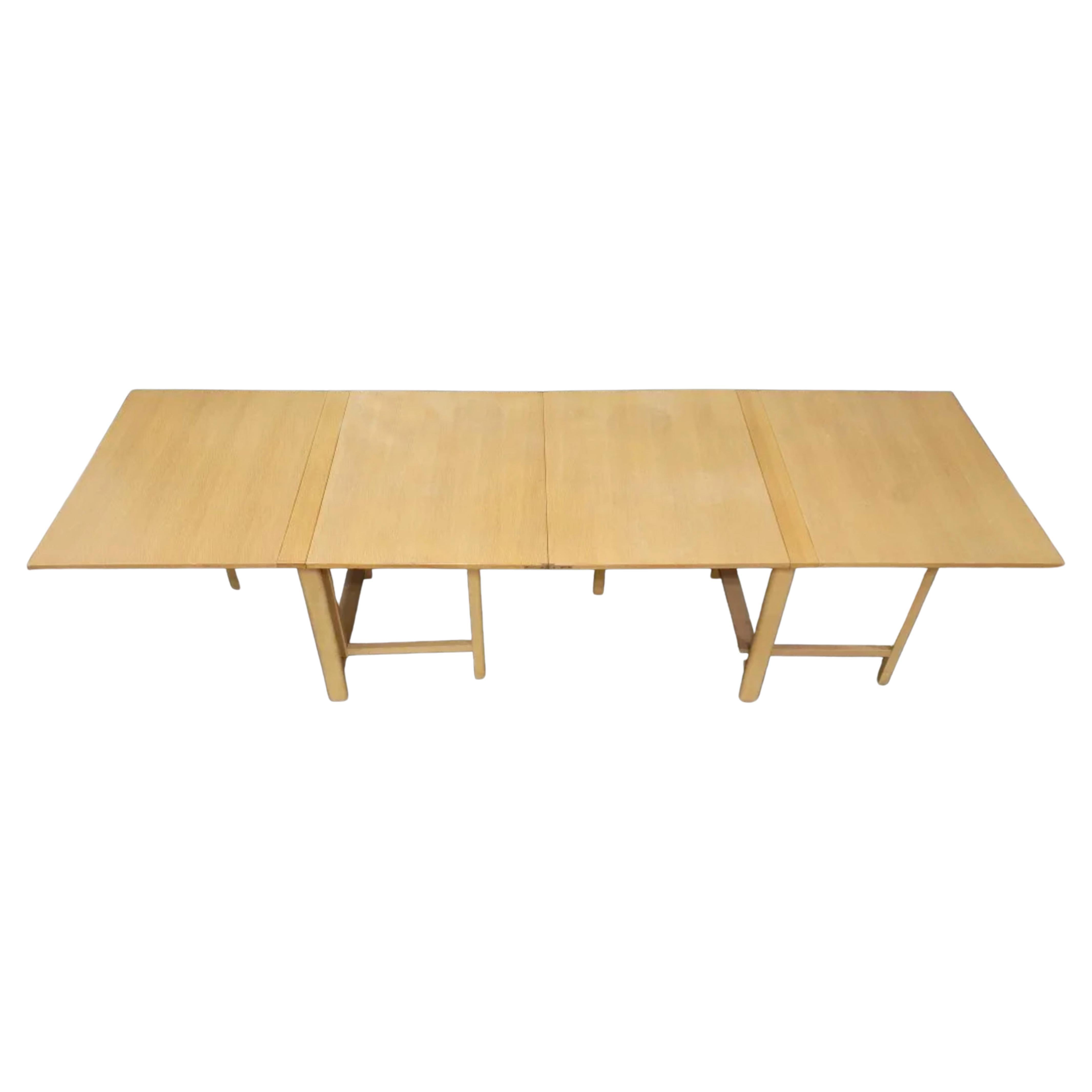 Mid-Century Modern Maria folding extension dining table by Bruno Mathsson. Table is beech wood blonde finish with brass hardware. Good vintage condition. Table folds down very small to stow away while not using. Made in Swedish. Located in Brooklyn