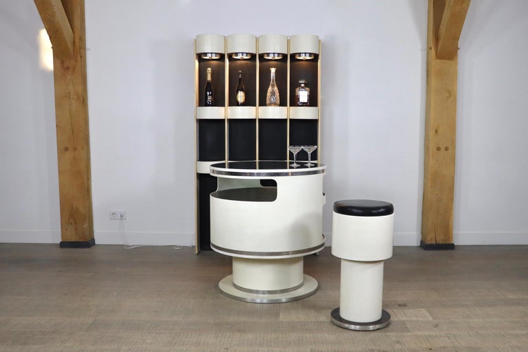 Stunning and very rare bar in black and white with bar stool attributed to the great designer Joe Colombo. The bar was produced in the 1960s. The stunning space age design details make this gorgeous piece even more unique! The Fiberglass base and