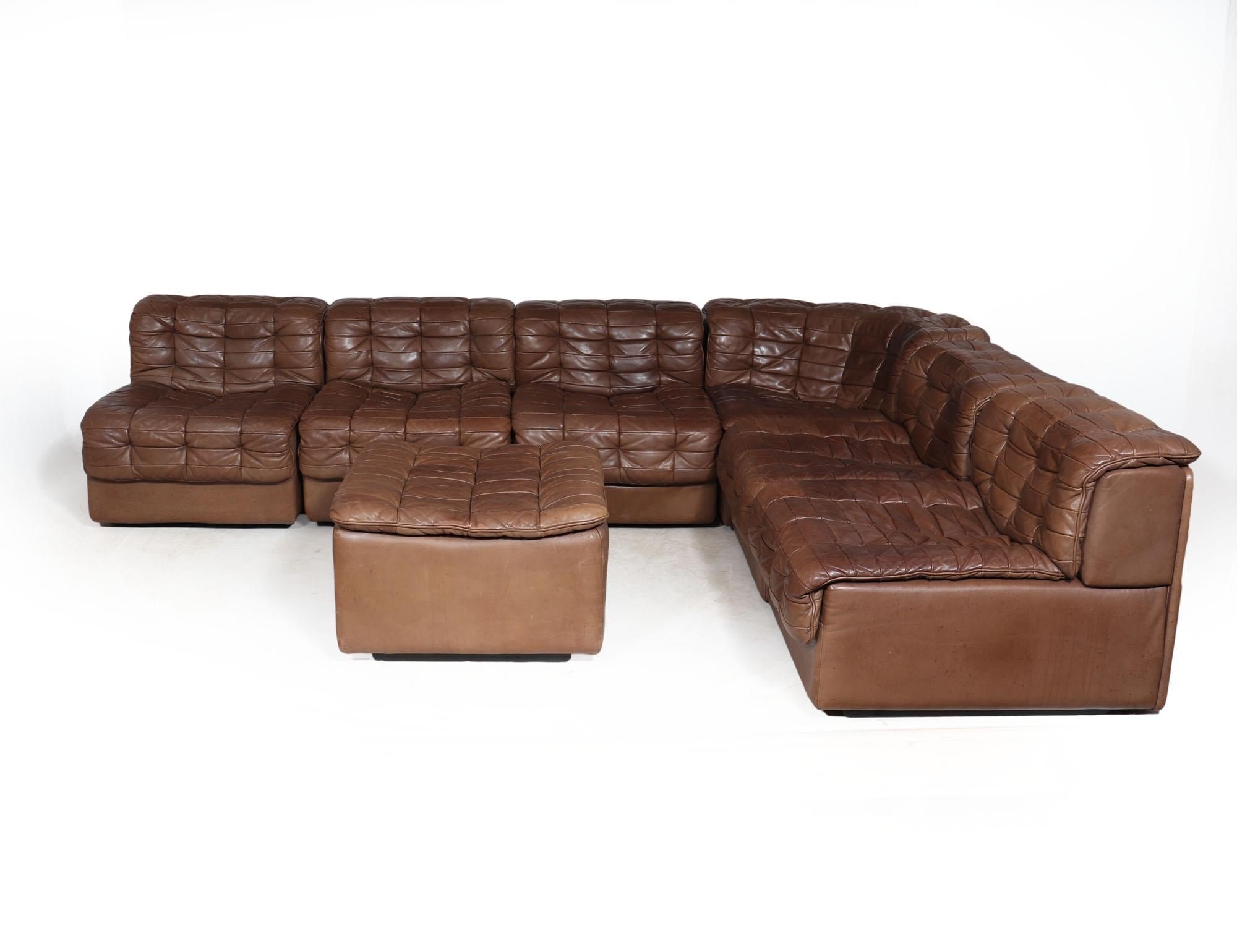 DS11 MODULAR SOFA  BY DE SEDE
A six section Modular corner sofa produced in patchwork leather in the 1970’s by renowned sofa manufacturers De Sede. It consists of one corner element, five seating elements and a footstool in tan leather with lovely