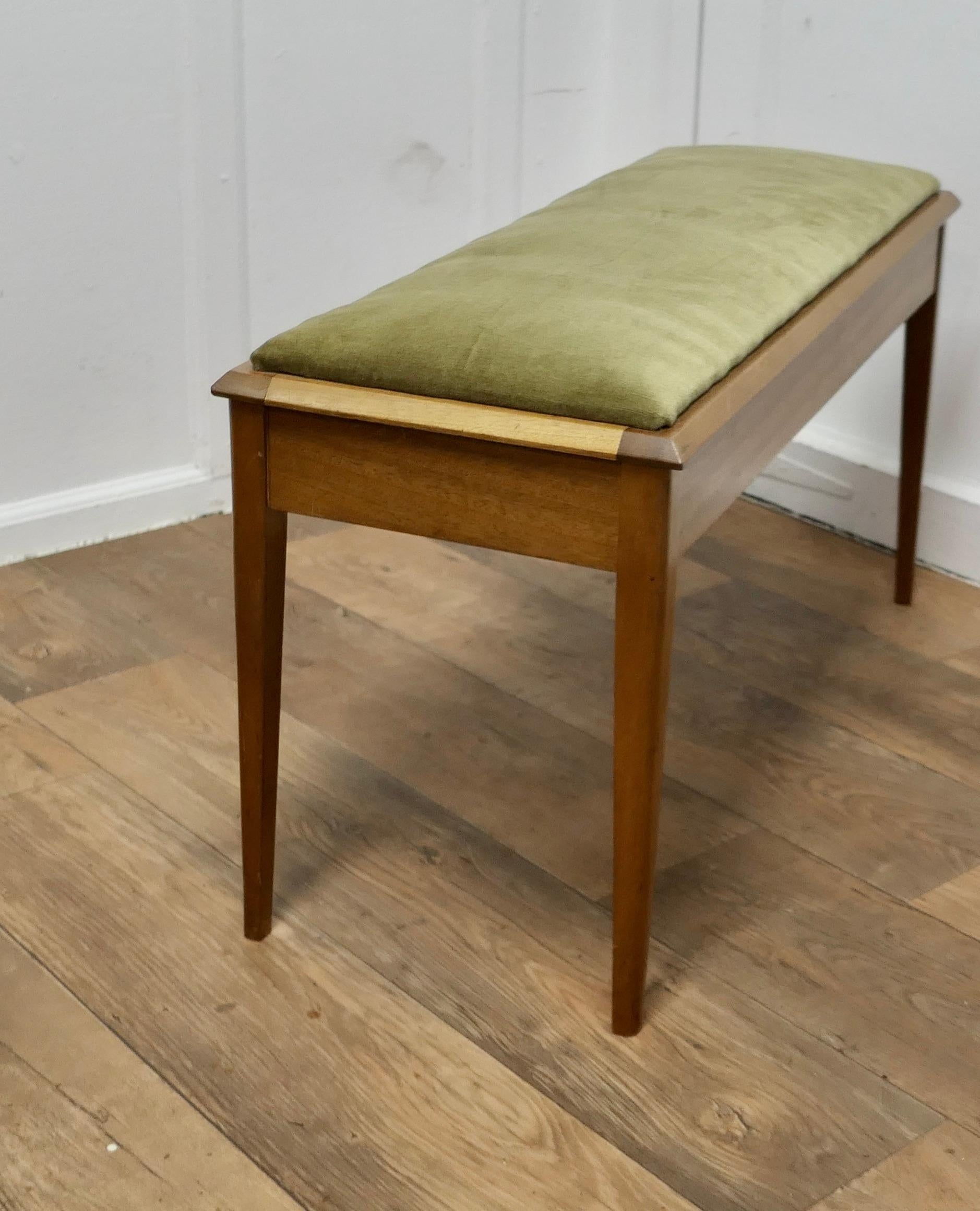 Mid Century Duet Stool or Window Seat with Storage

This is a Box style stool with good manuscript storage beneath inside,  the seat is upholstered in Olive Green Velvet, it is in good clean condition
The Stool is 37” long, 19” high and 14”