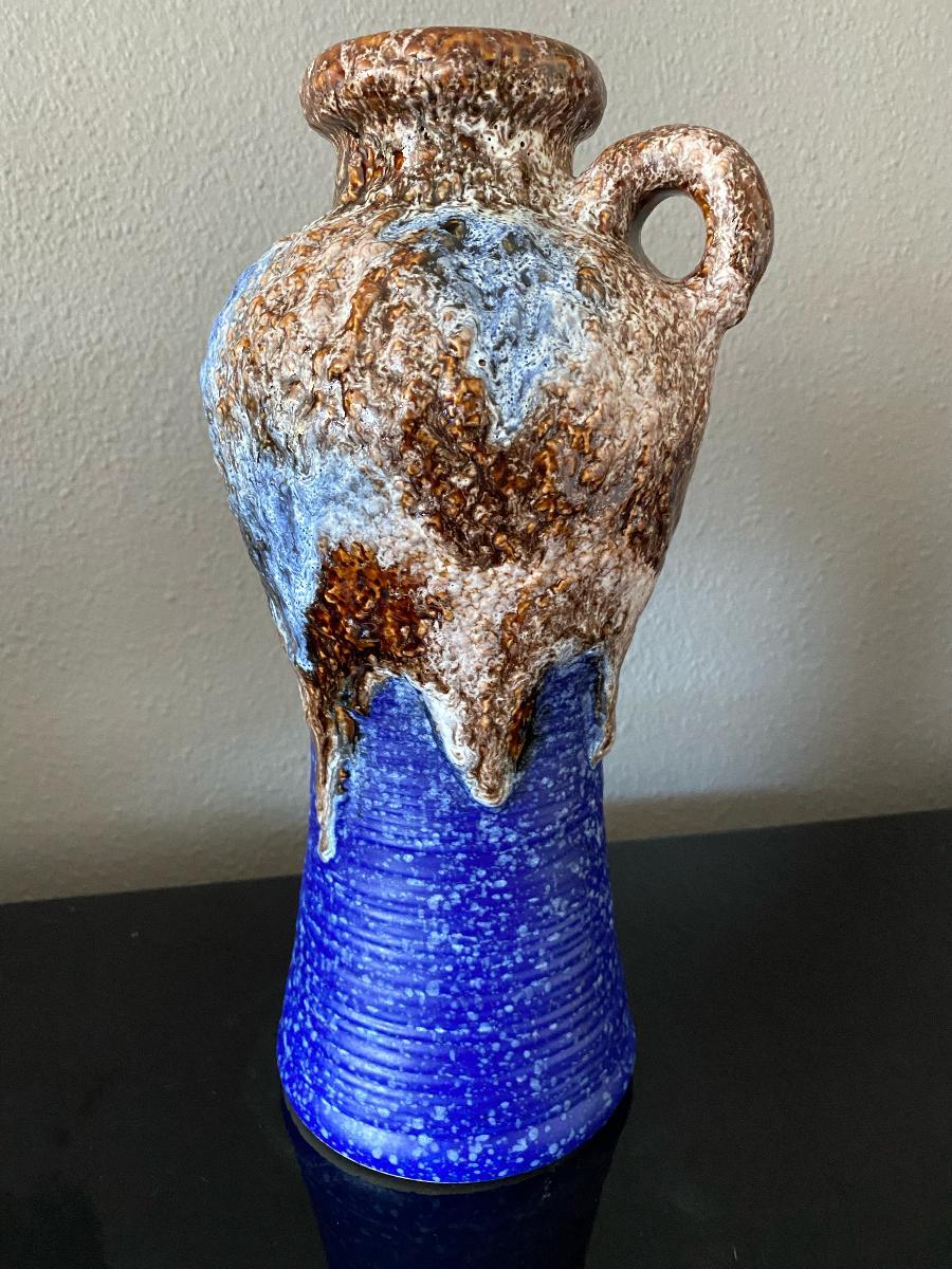Stunning fat lava vase - dark and light blue with brown, blue and white fat lava glaze
According to Mark Hill the quality of Dümler & Breiden pieces is very high, and pieces are often distinguished by their unique, outlandish style with diverse