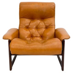 Mid century Dutch modern tufted leather lounge chair and ottoman