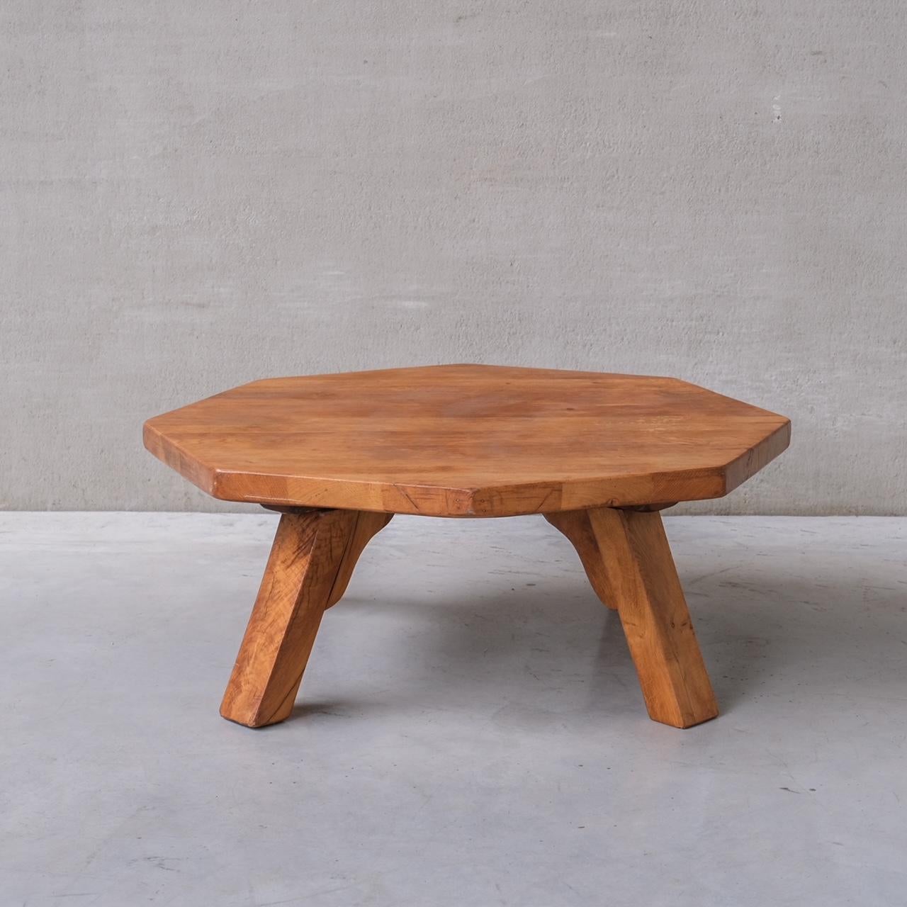 A large oak octagonal coffee table. 

Belgium, circa 1970s. 

Raised over four chunky legs. 

Good vintage condition, some scuffs and wear commensurate with age. 

INTERNAL REF: 284/CT008 

Location: Belgium Gallery. 

Dimensions: 118 W