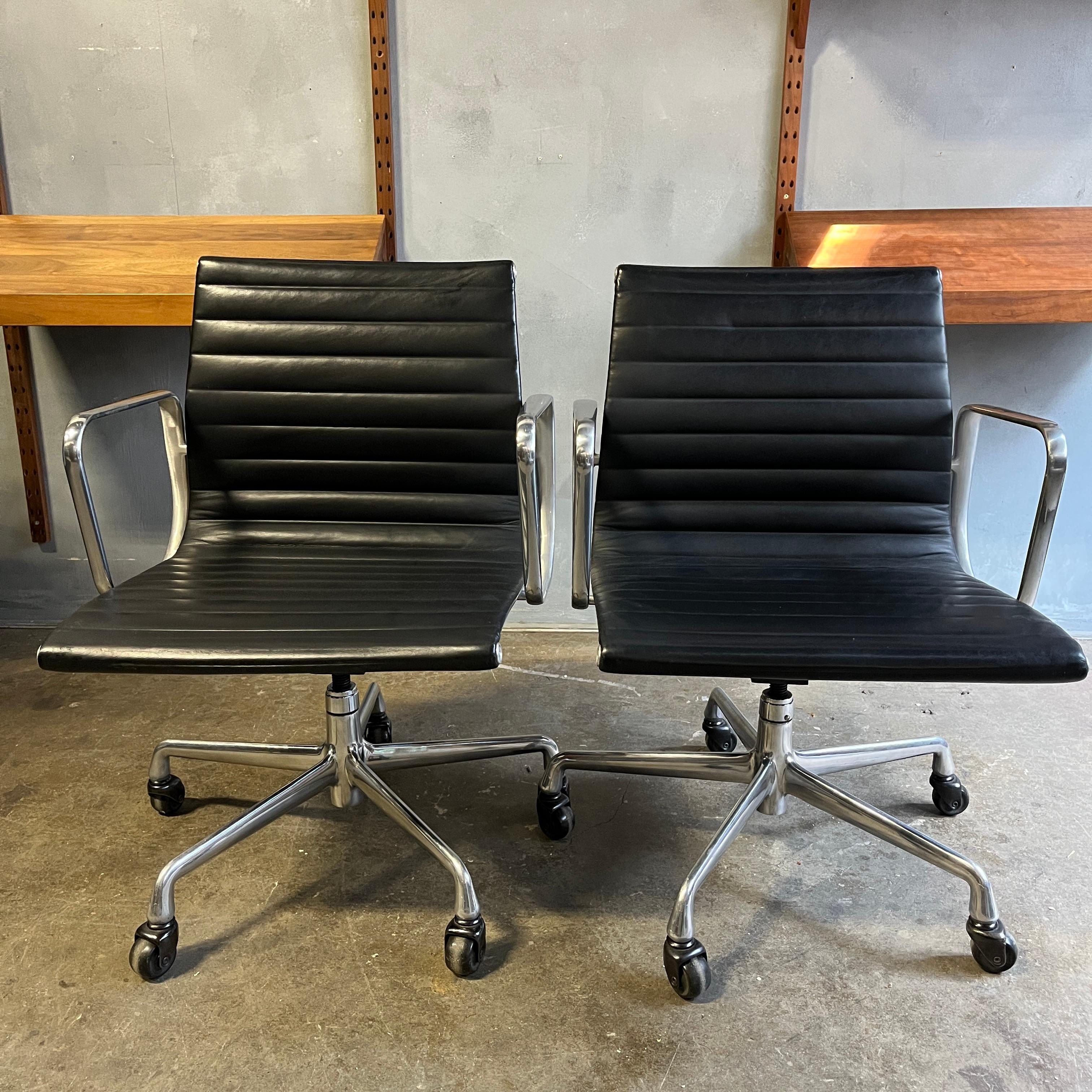 For your consideration are up to 2 aluminum group chairs in black leather designed by Eames for Herman Miller. All in very good original condition showing minimal wear. With manual tilt and height adjustment. wheels are for hard wood floor surfaces.