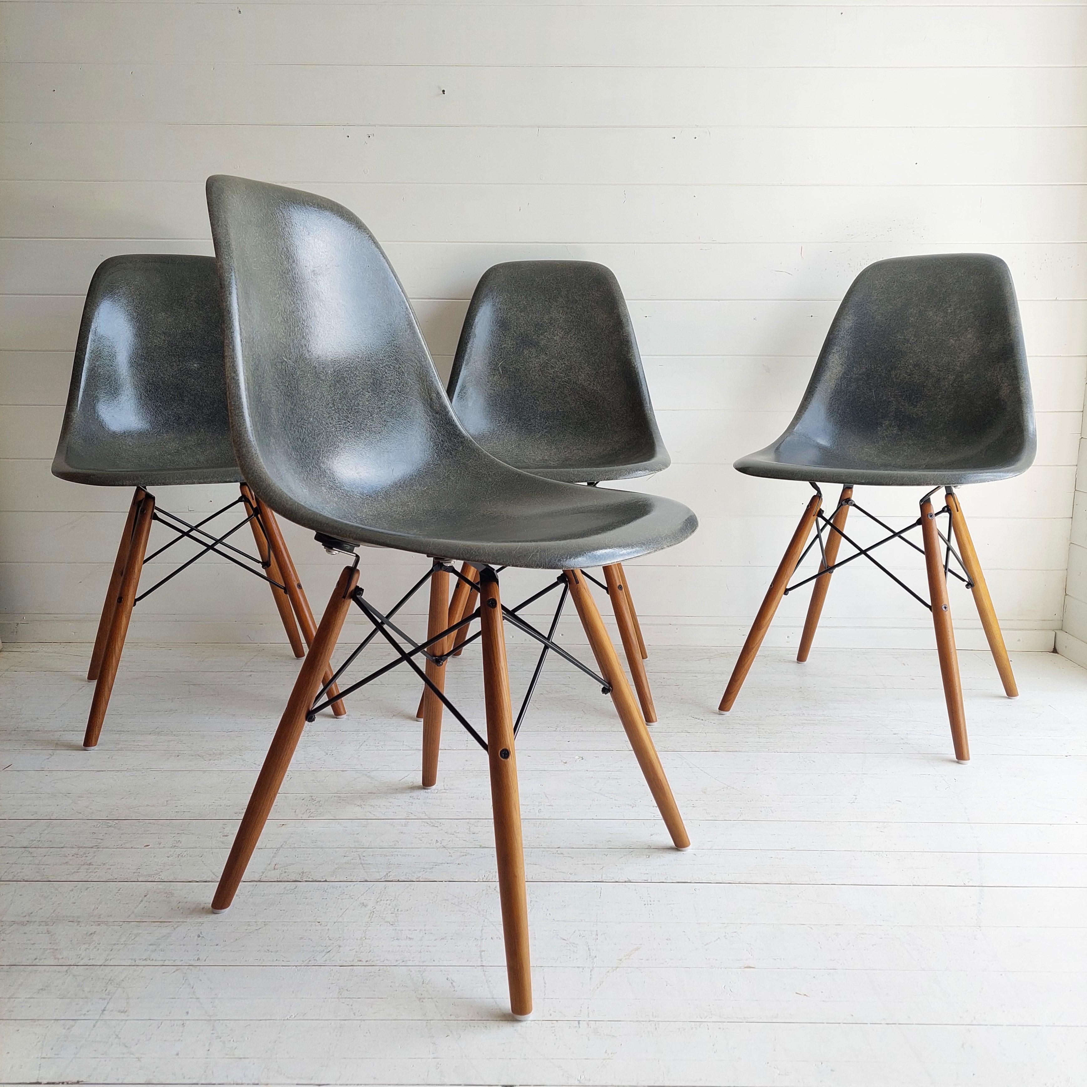 This is an original 1950s Eames fiberglass set of 4 shell chairs with original model sticker and stamp. 
Stamped with the 