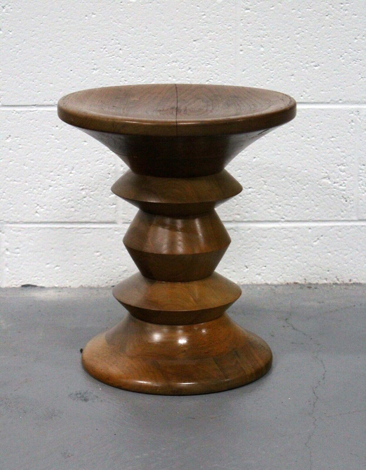 For your consideration is this iconic Charles and Ray Eames for Herman Miller sculptural Walnut stool/side table. Original designed for the lobby of the time-life building in New York City, this piece is equally art and function. Dimensions: 13