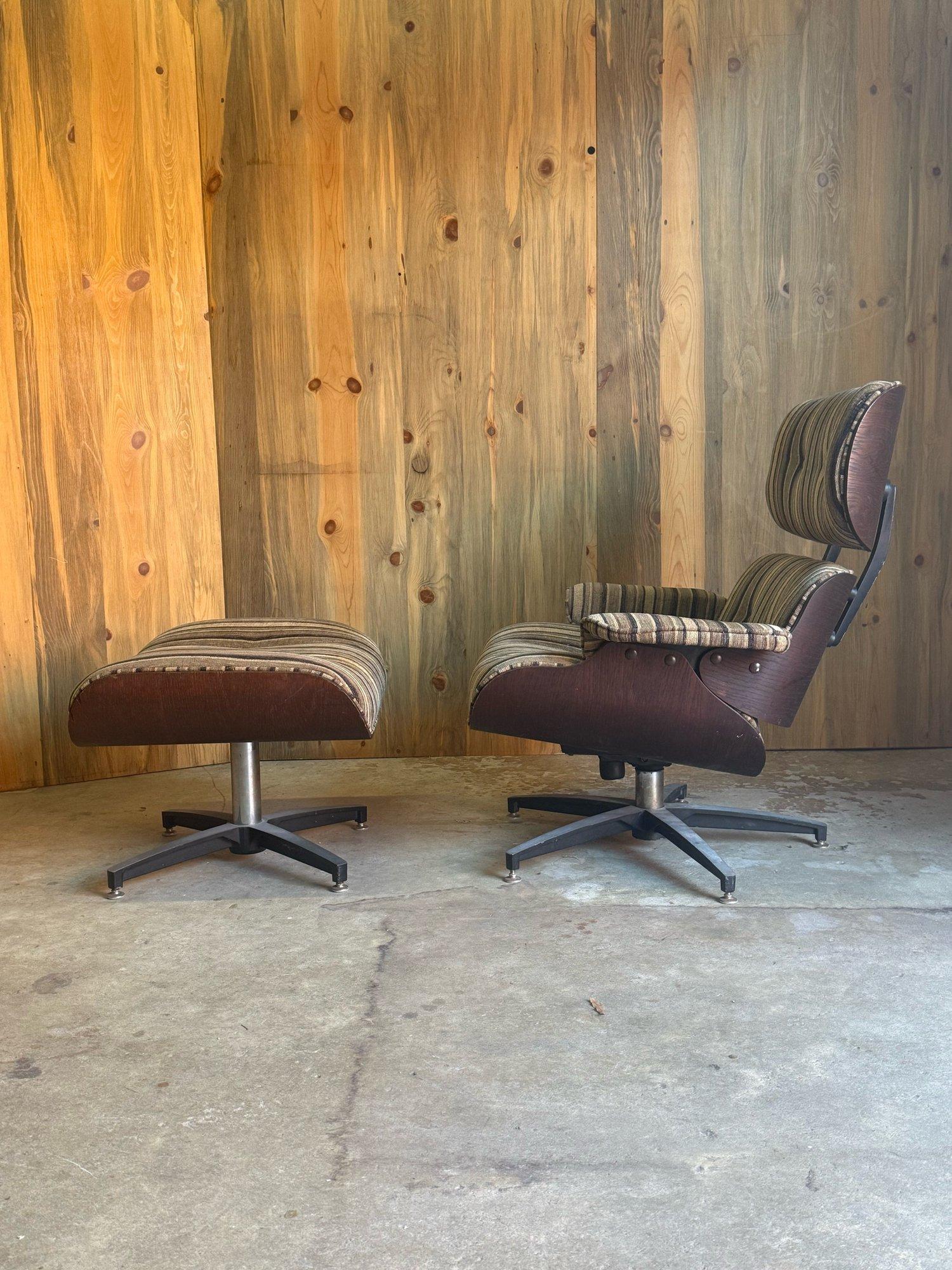 Mid-century lounge chair and ottoman in the style of the iconic Eames lounge. Made from bentwood walnut in warm tones, showcasing clean lines and a gentle curves. The chair and ottoman both sit on chrome and black metal star bases that have swivel
