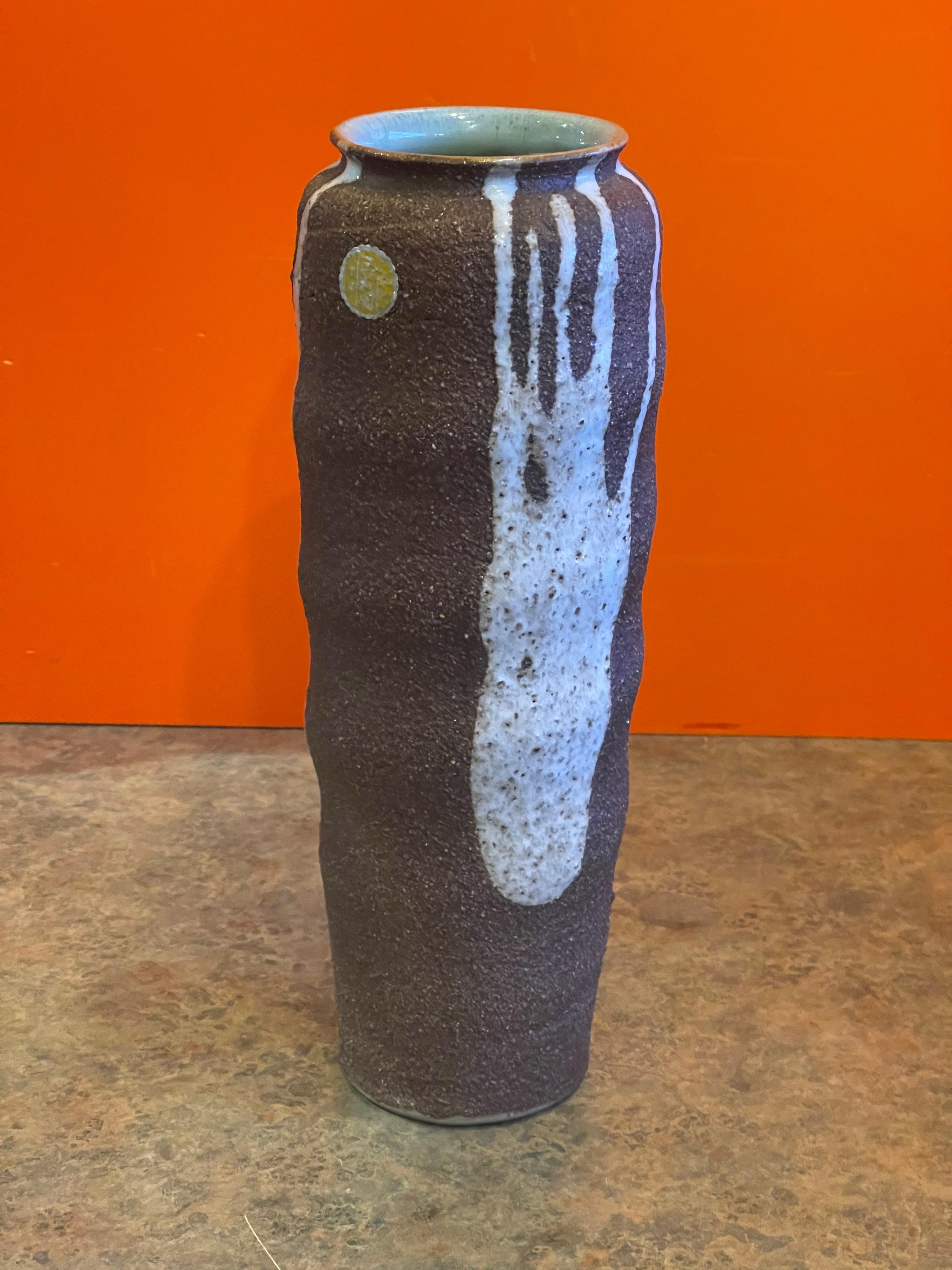 Mid-century earthenware pottery vase with drip glaze, circa 1970s. The vase was made in Japan and is in very good vintage with no chips or cracks; it measures 4.5