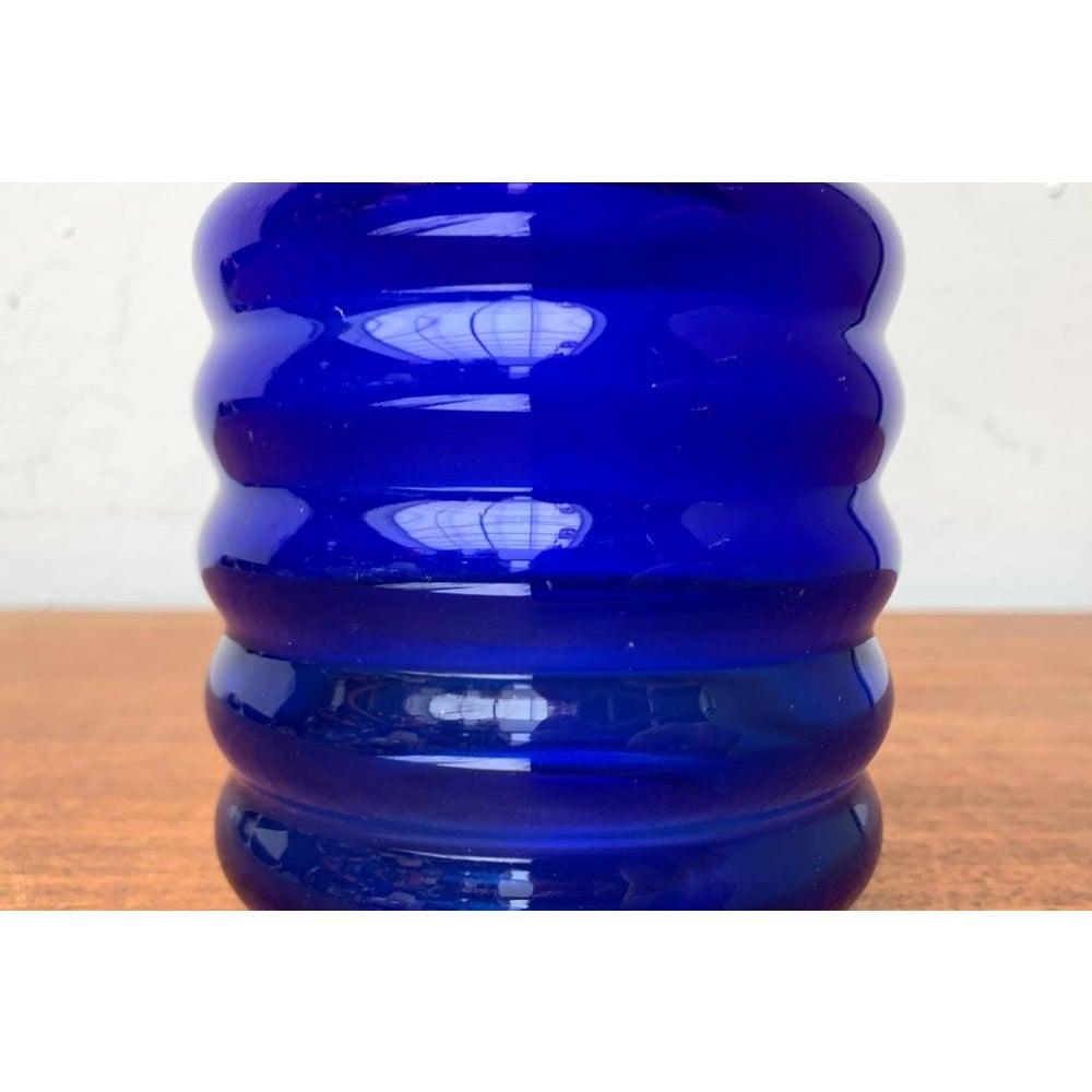 Mid-Century East German GDR Glass Vase from Veb Glaswerk Harz Derenburg, 1960s, in Very Good conditions. Designed 1960 to 1969 This piece has an attribution mark.

Additional information:
Materials: Glass
Color: Blue
Styles: Mid-Century